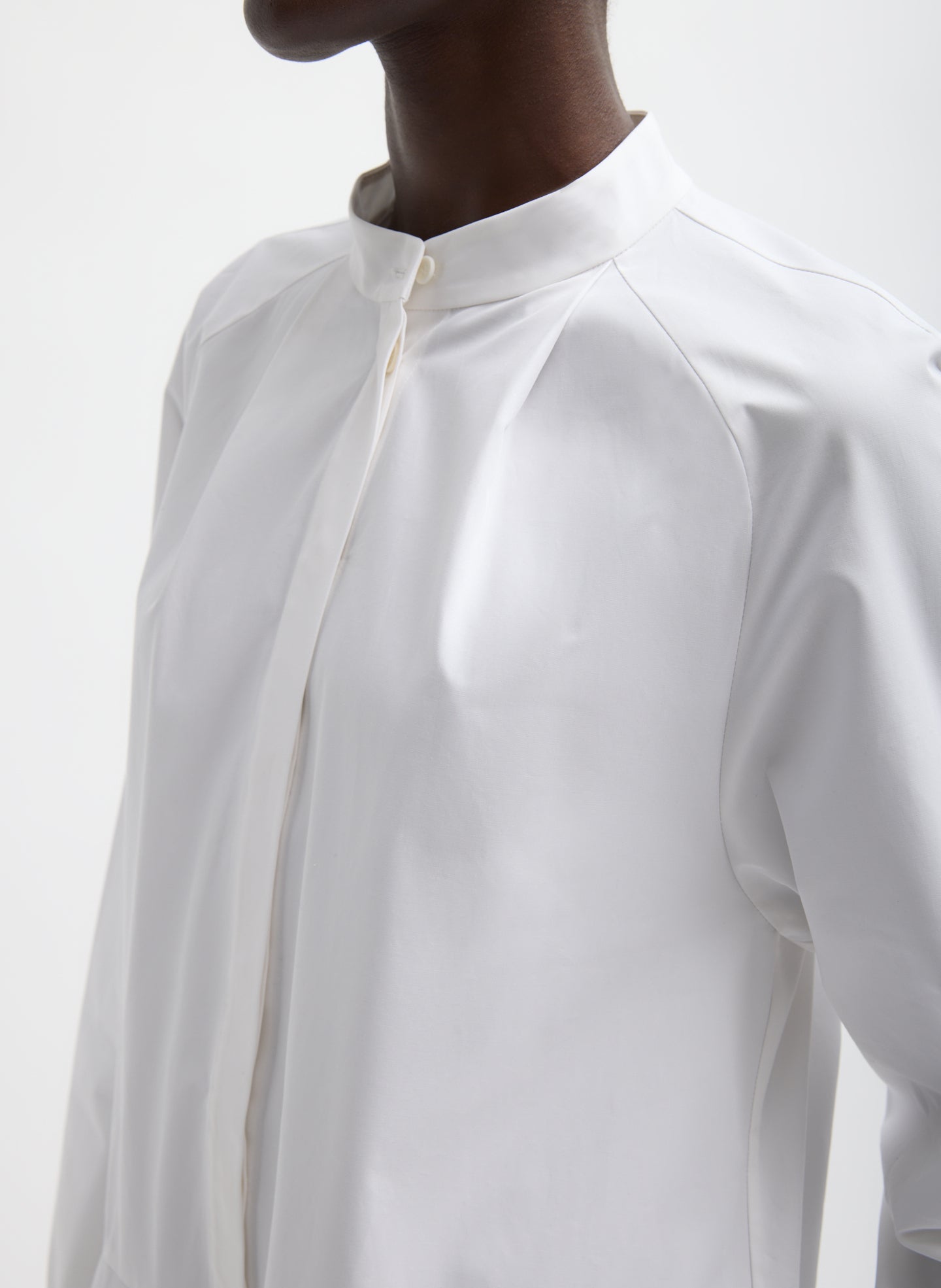 White Compact Eco Poplin Balloon Dress - closeup of front button up detail