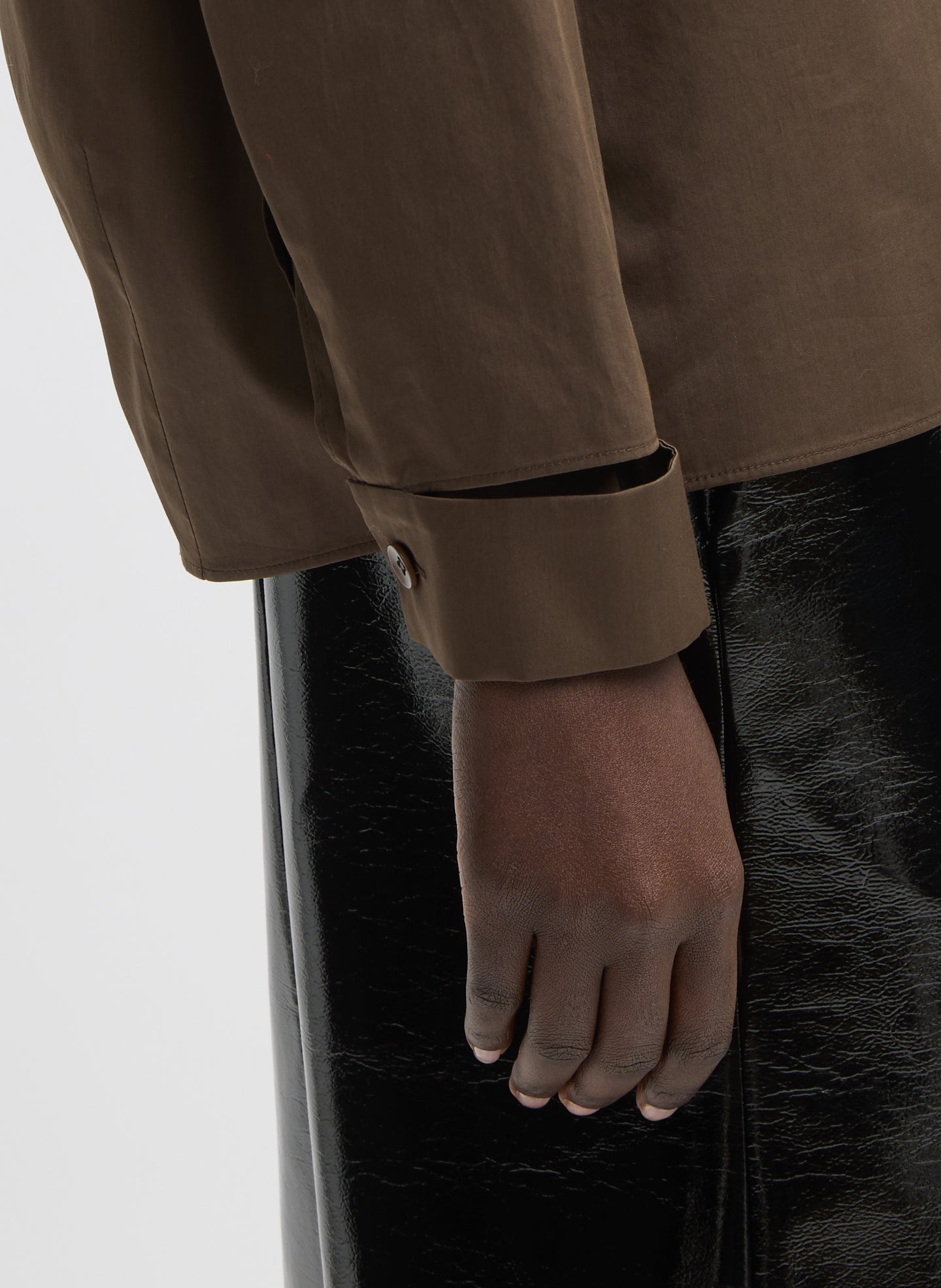Brown Eco Poplin V-Neck Dolman Top - closeup of cutout wrist detail