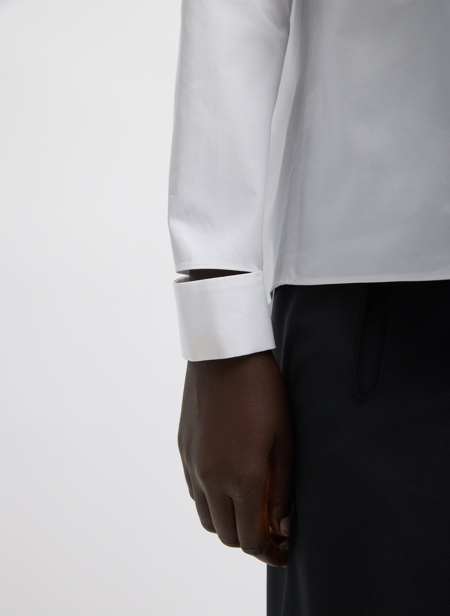 White Eco Poplin V-Neck Dolman Top - closeup of cutout detail at wrist