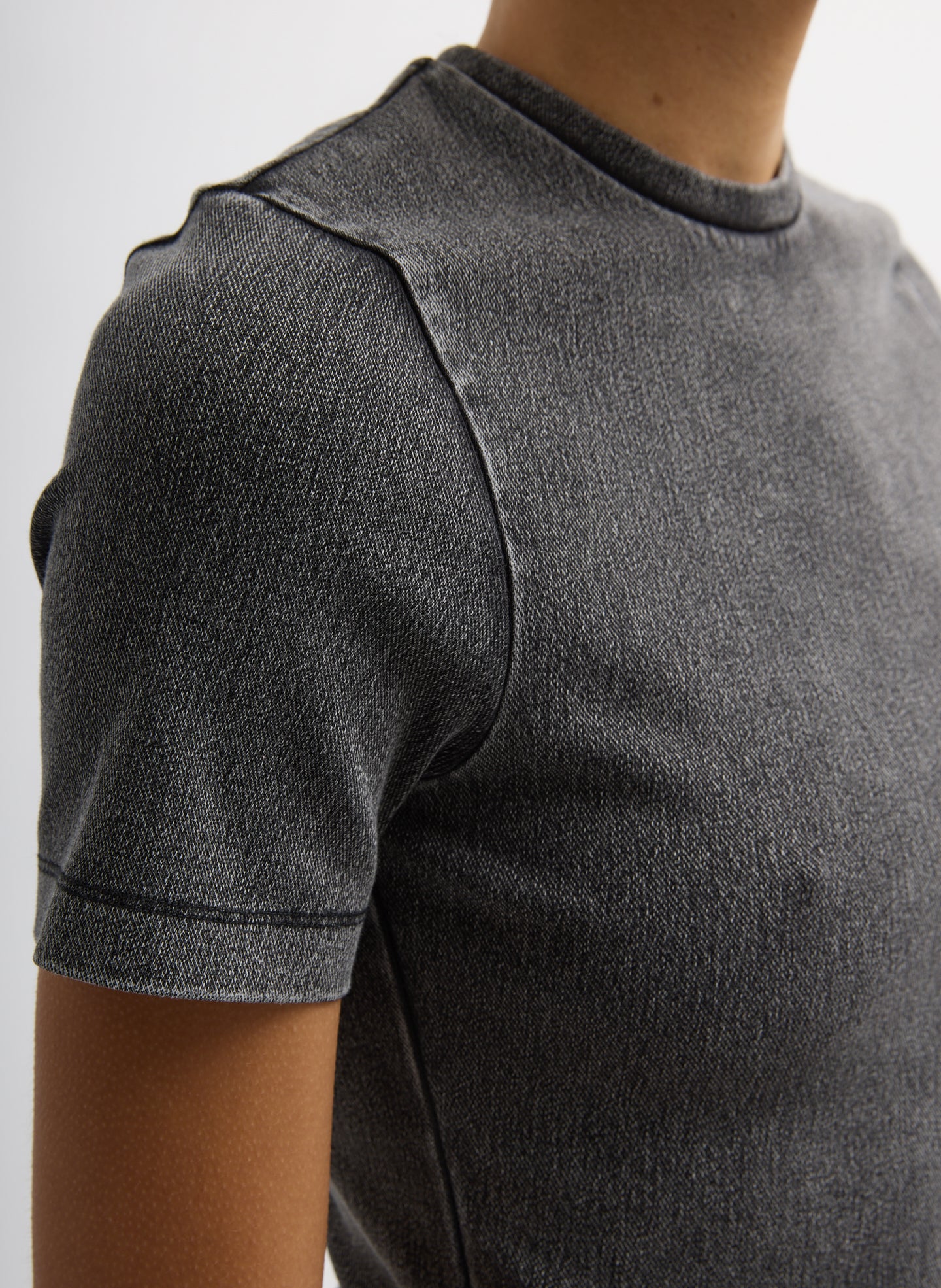 Black Stretch Denim Baby T-Shirt - closeup of seam and sleeve detail