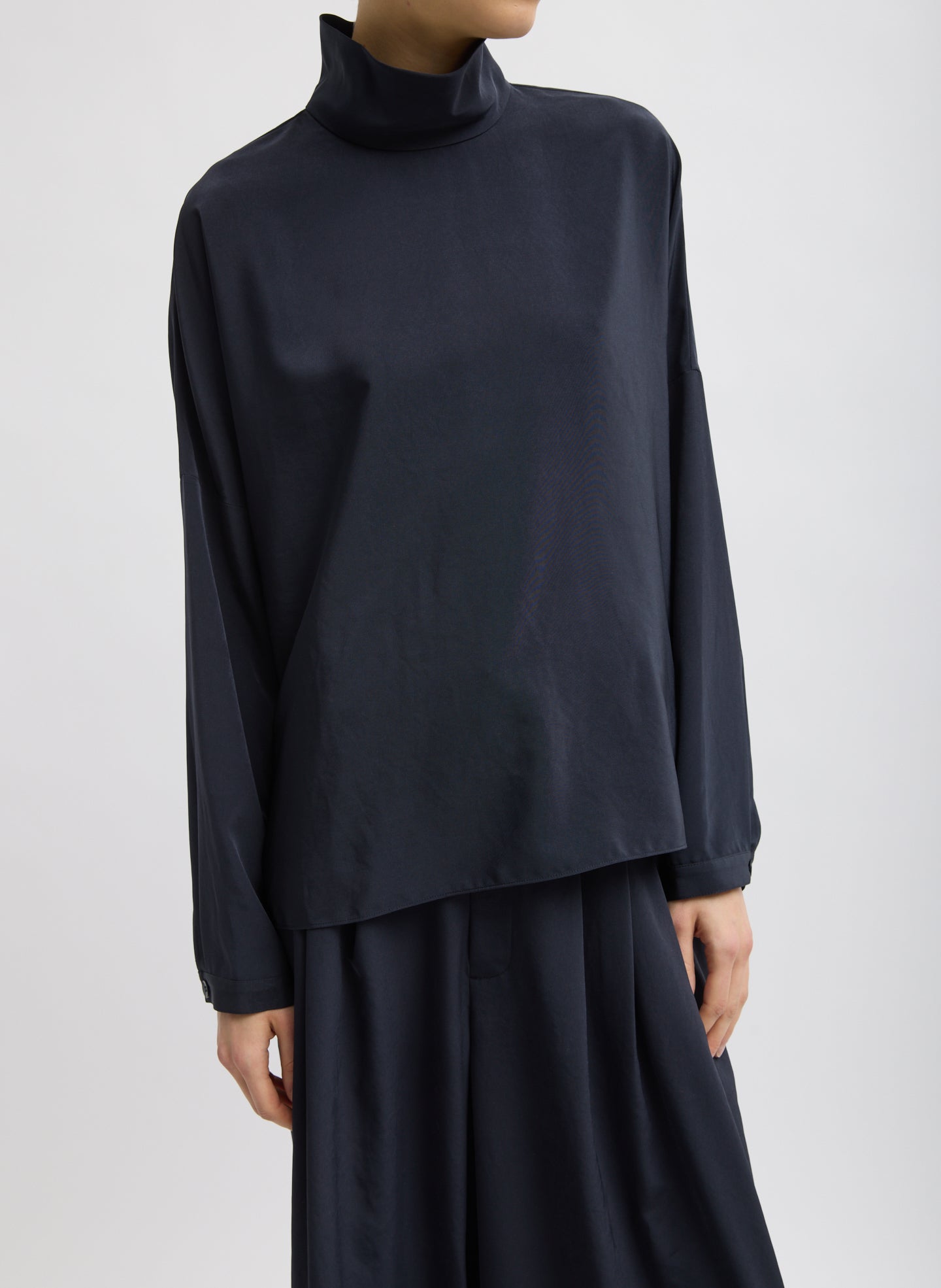Navy Relaxed Suiting Funnel Neck Dolman Sleeve Top - front view on model