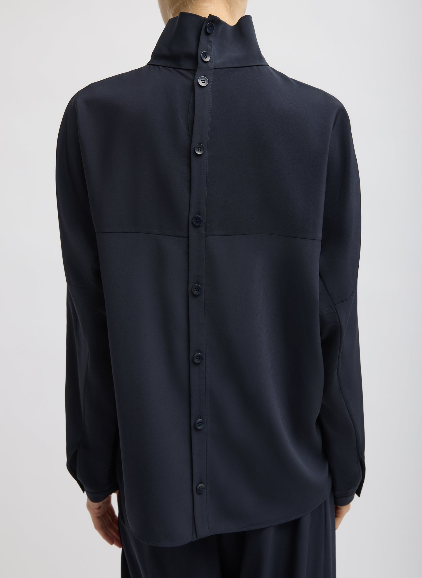 Navy Relaxed Suiting Funnel Neck Dolman Sleeve Top - back view on model