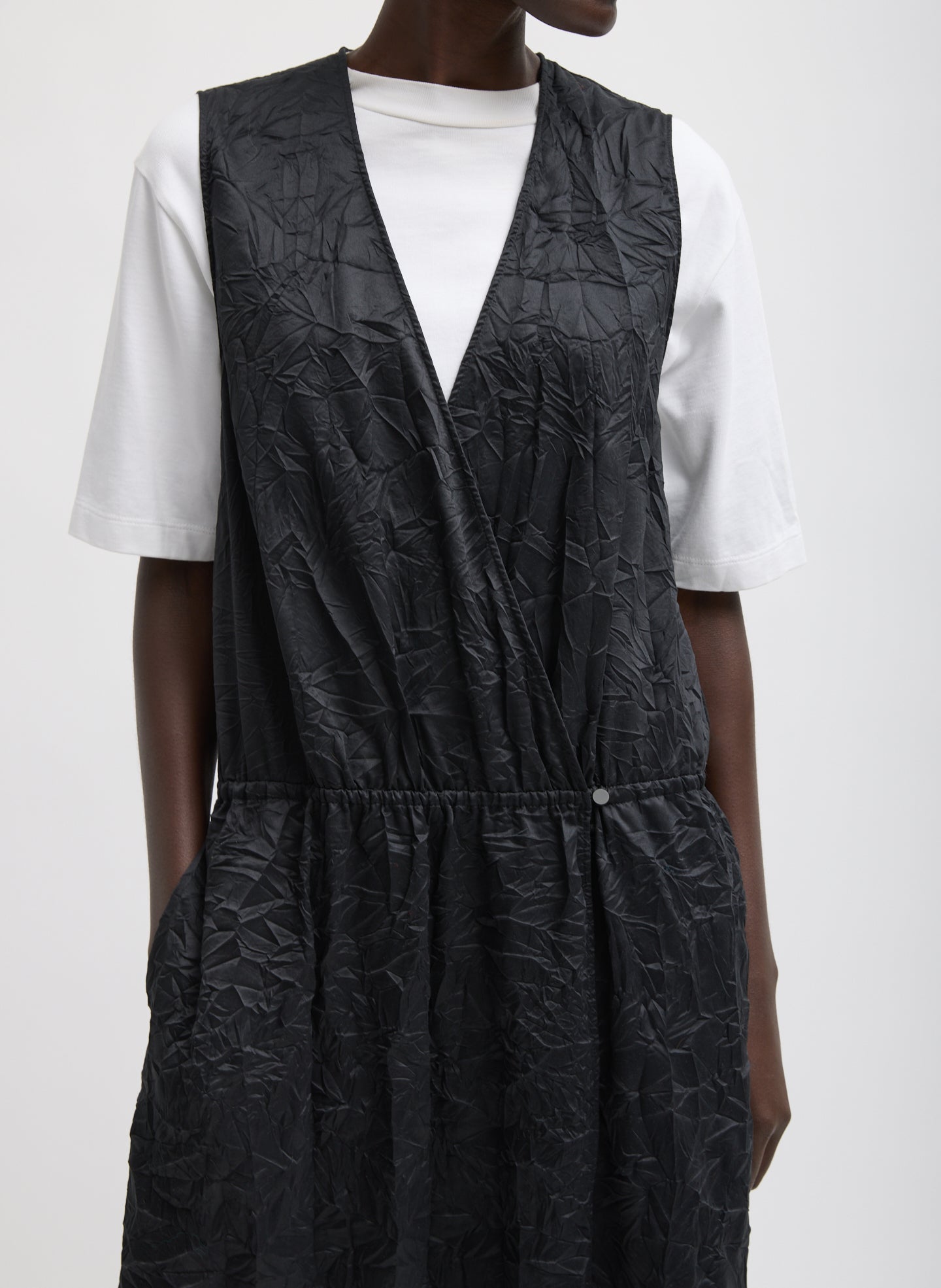 Black Tech Crush Wrap Dress - closeup of neckline and hand-crinkled fabric