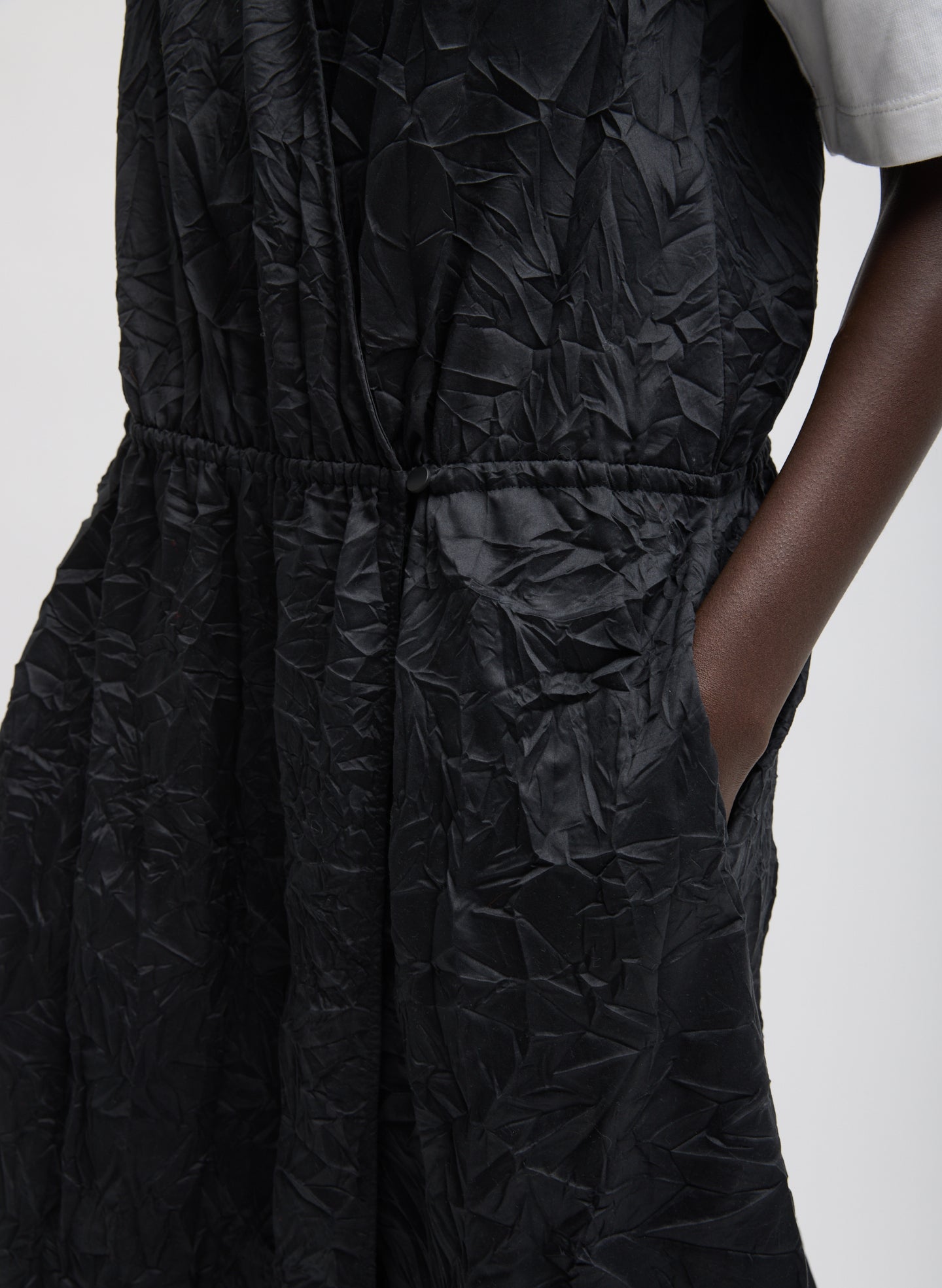 Black Tech Crush Wrap Dress - closeup of waist band and hand-crinkled fabric