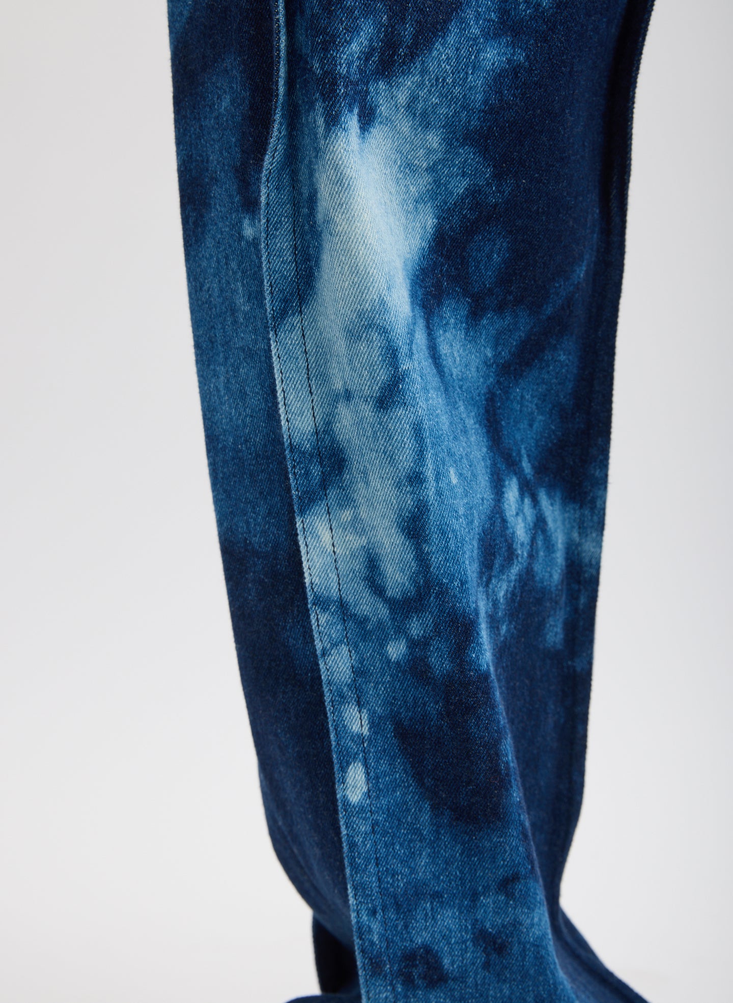 Tie Dye Denim Tuck Jean - closeup of tie dye detail