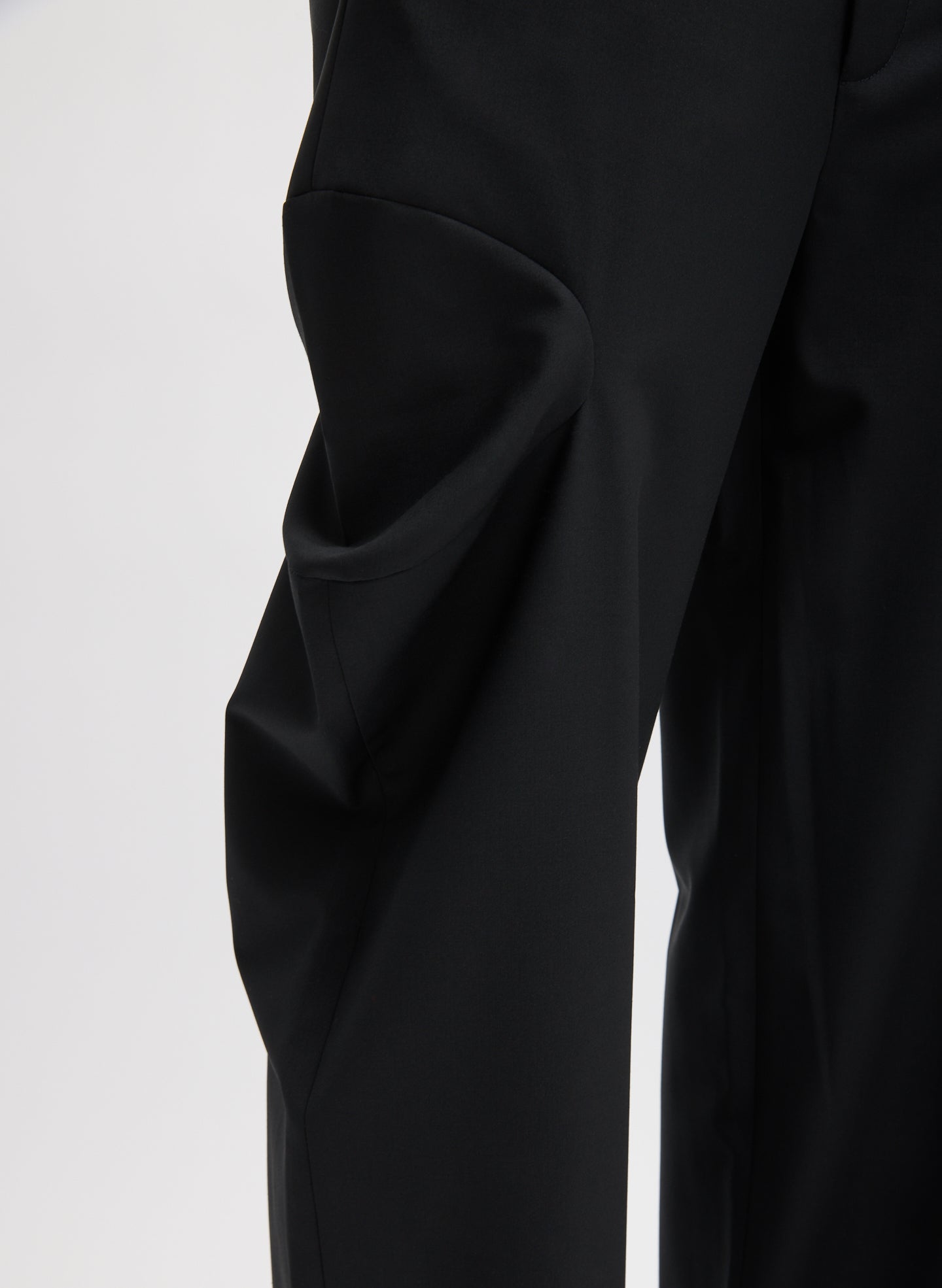 Black Recycled Tropical Wool Sculpted Meir Trouser - closeup of cutout detail at side