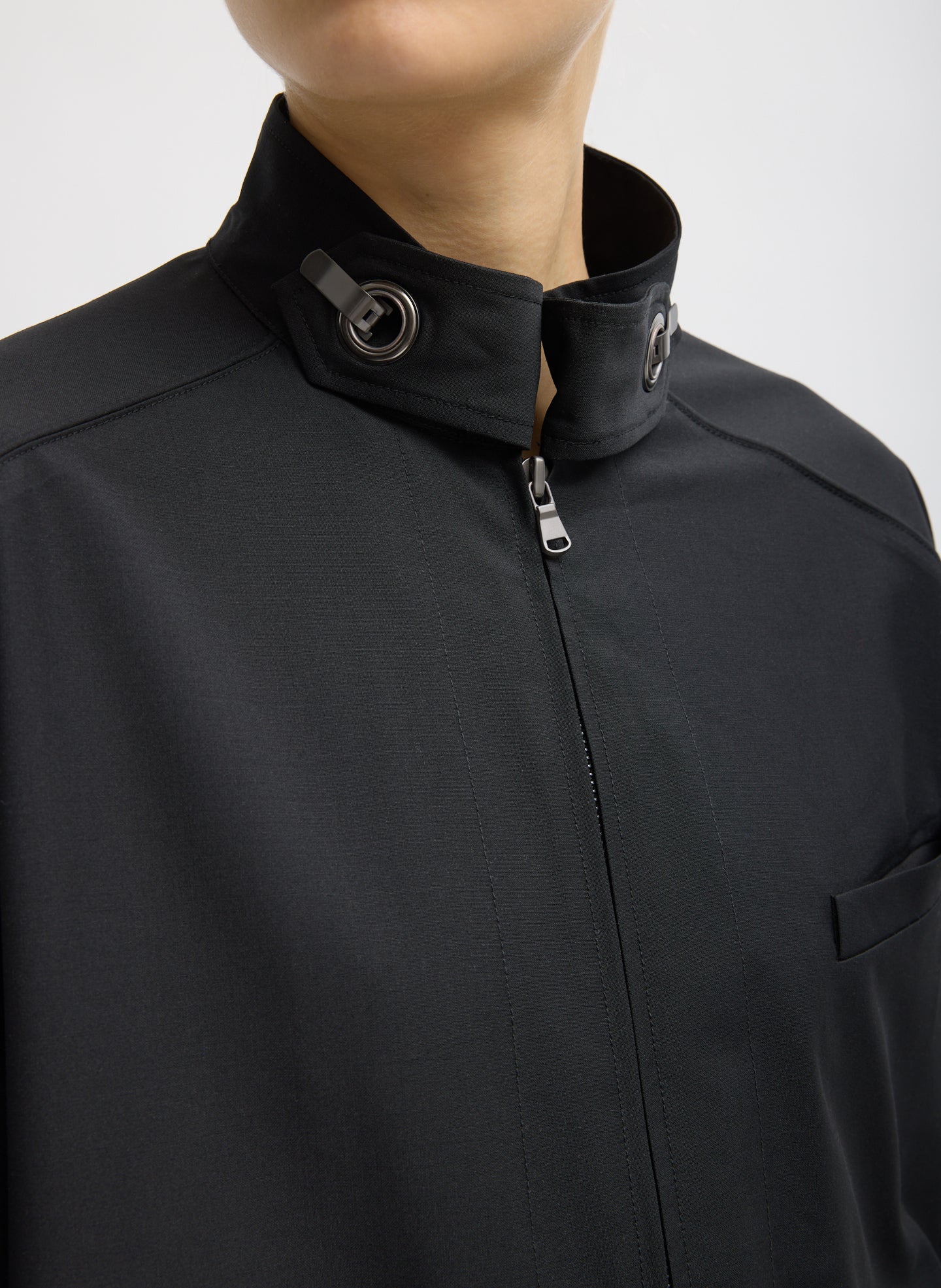 Black Recycled Tropical Wool Moto Bomber - closeup of hardware detail at collar