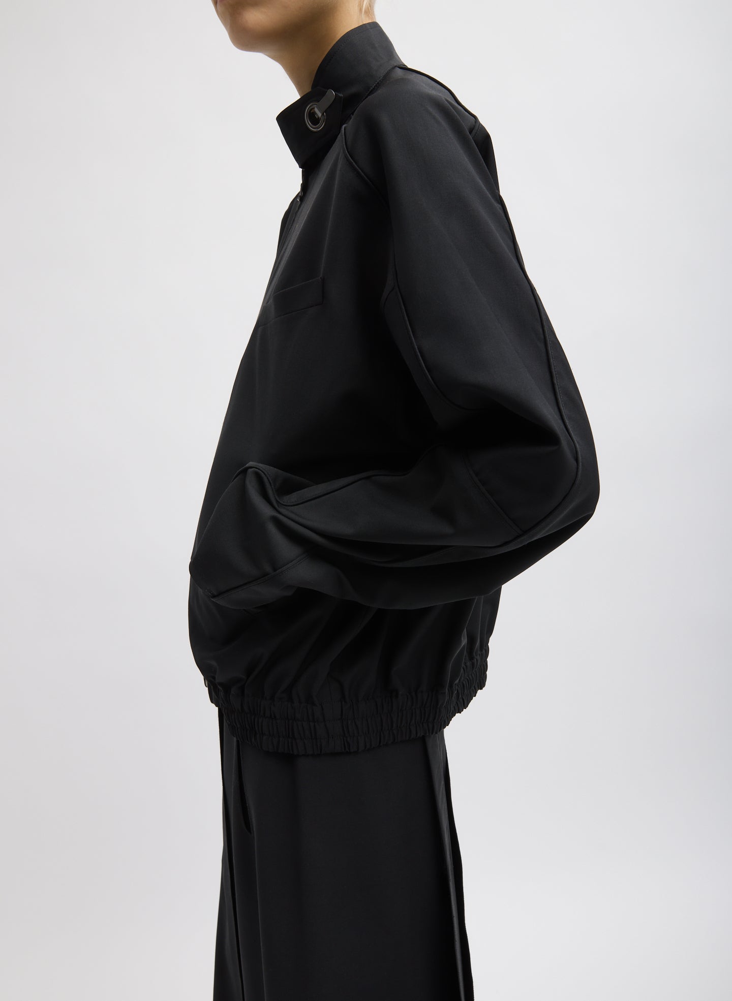 Black Recycled Tropical Wool Moto Bomber - side view on model