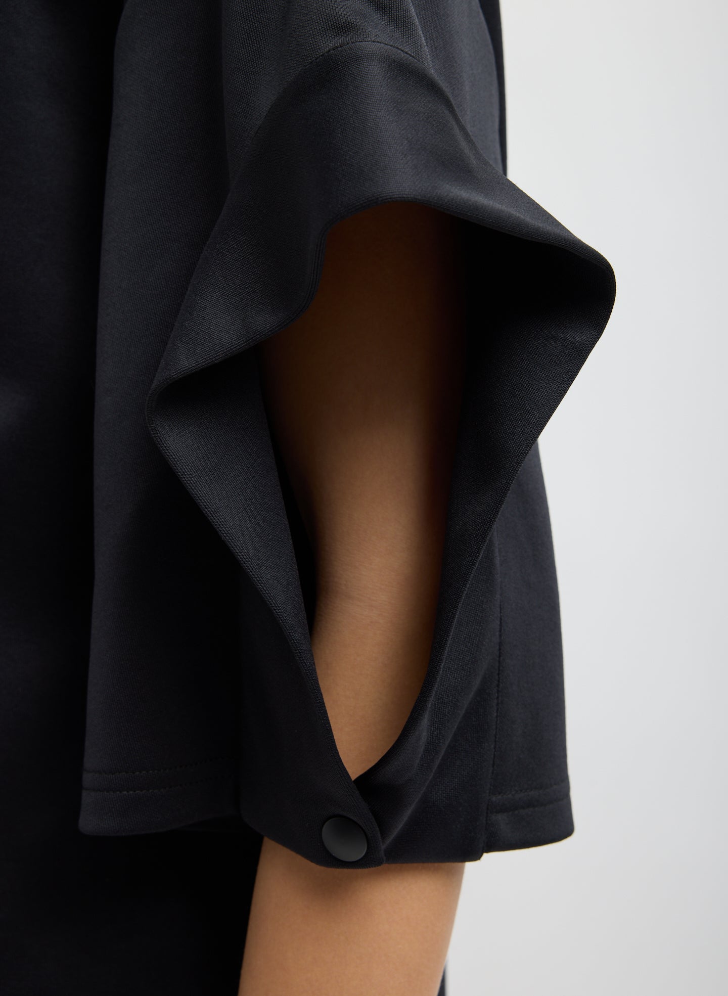 Black Active Knit Easy Drape Sleeve T-Shirt - closeup of sleeve detail