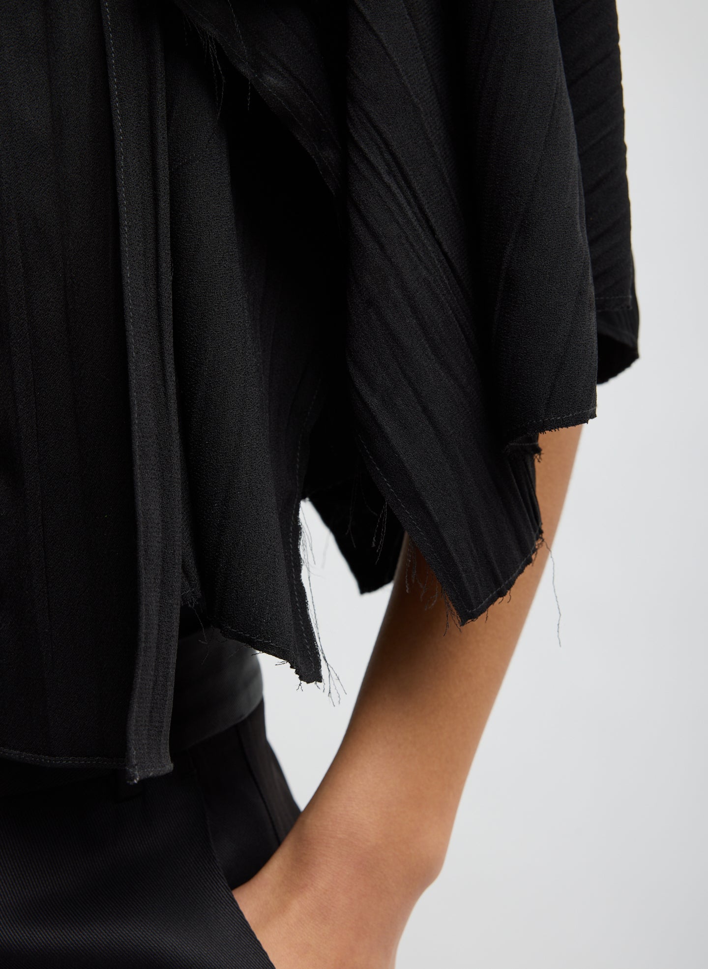 Black Creased Acetate Cape Tie Top - closeup of raw edge detail