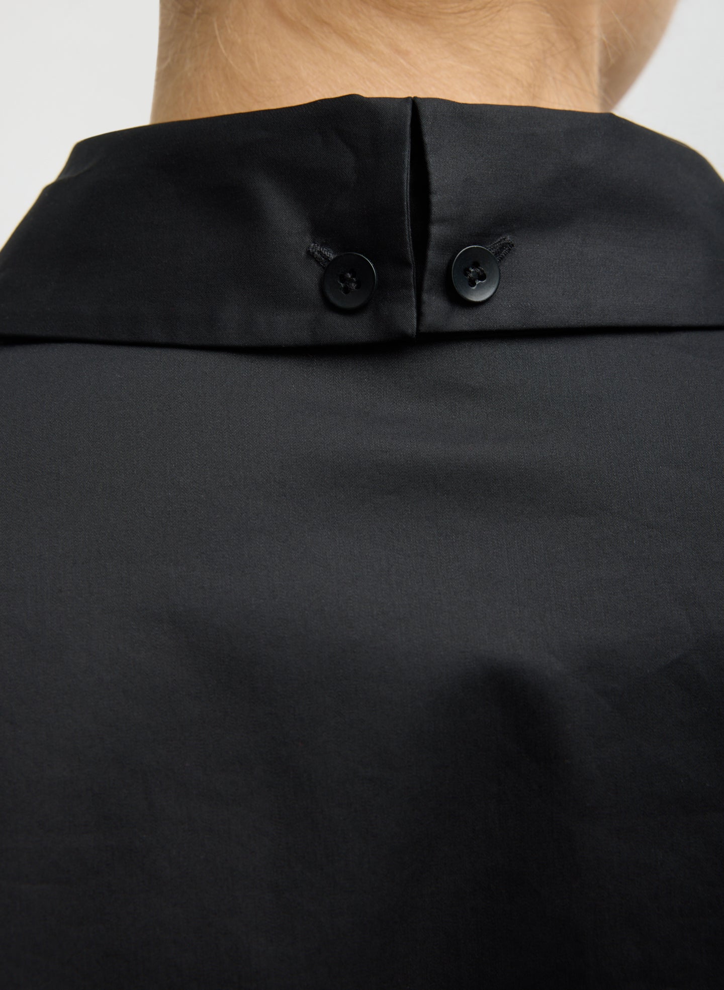 Black Eco Poplin Easy Shirt with Flap Detail - closeup of button detail at collar