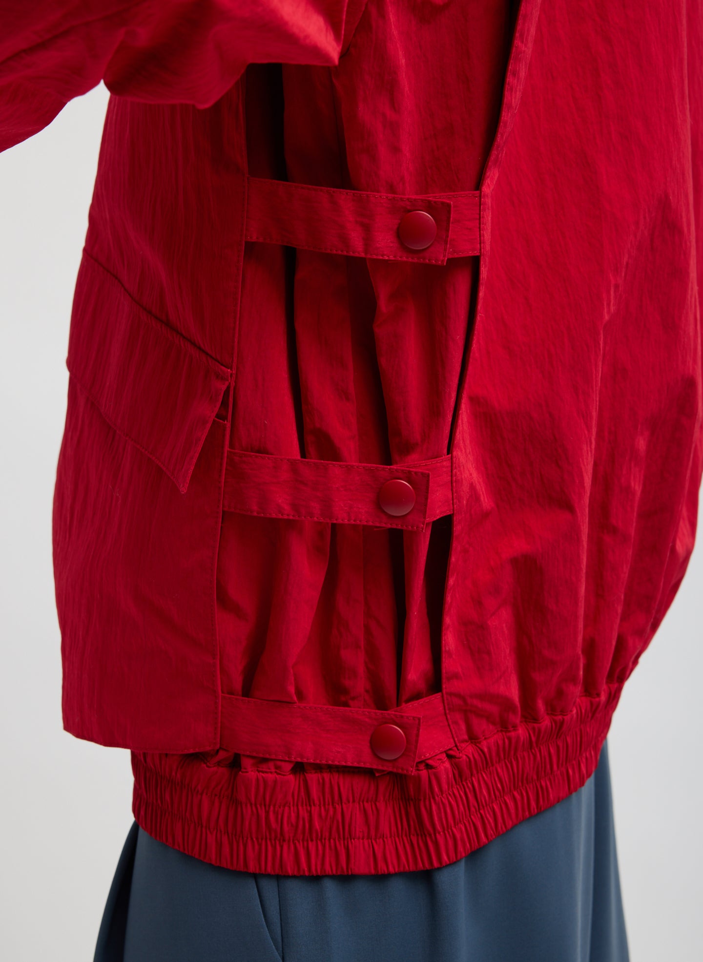 Red Fall Nylon Snap Bomber Jacket - closeup of side snap details