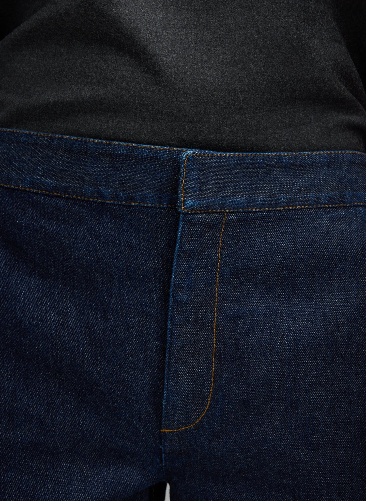 Dark Indigo Denim Pat Trouser Jean - closeup of front stitch detail