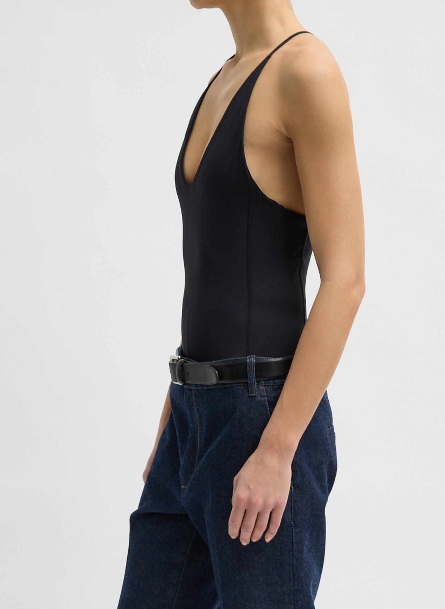 Black Stretch Lightweight Tech Knit Strappy Racerback Tank Top - side view on model
