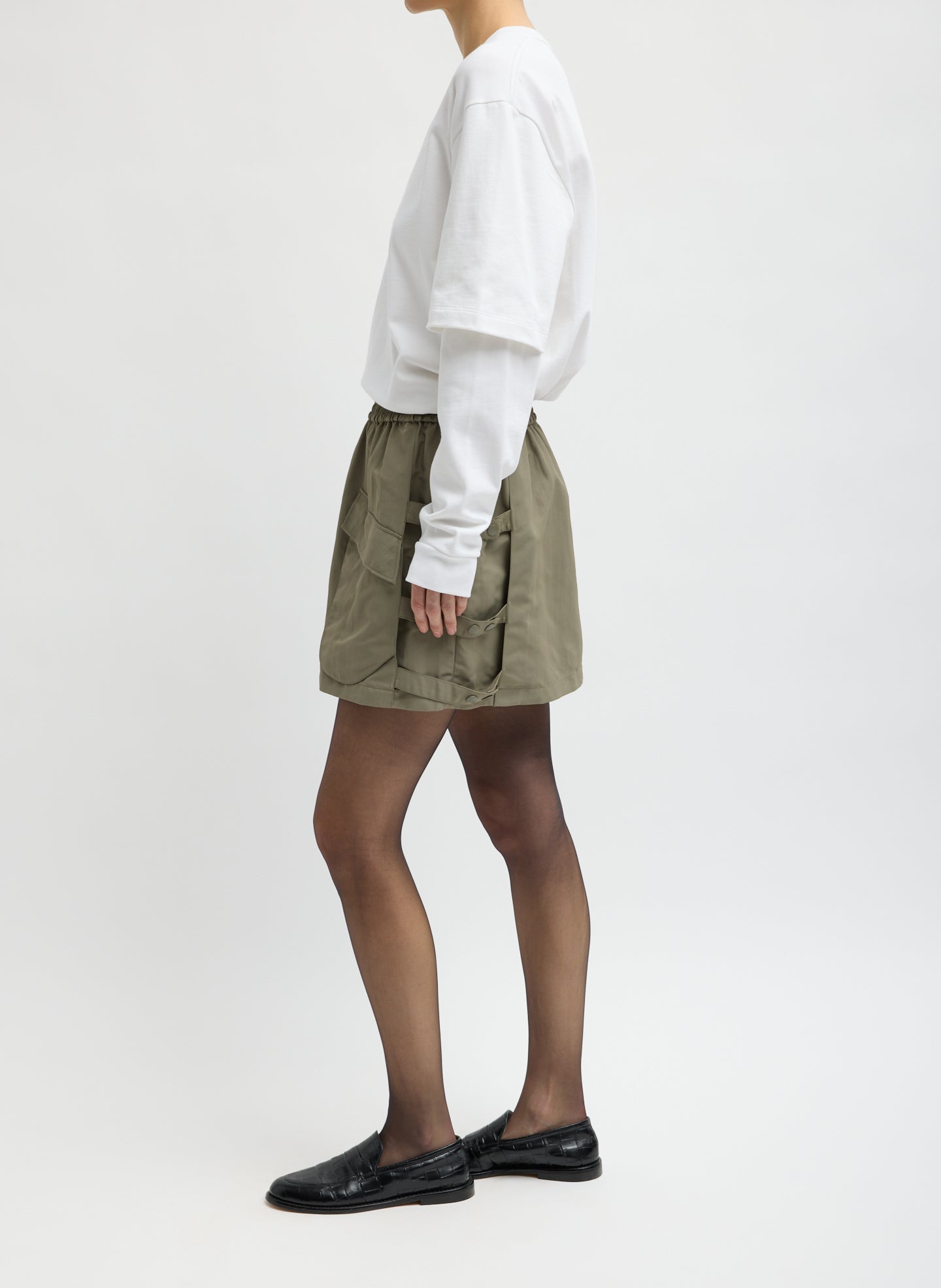 Dark Hazelnut Green Techy Twill Pull On Mini Skirt - side view on model