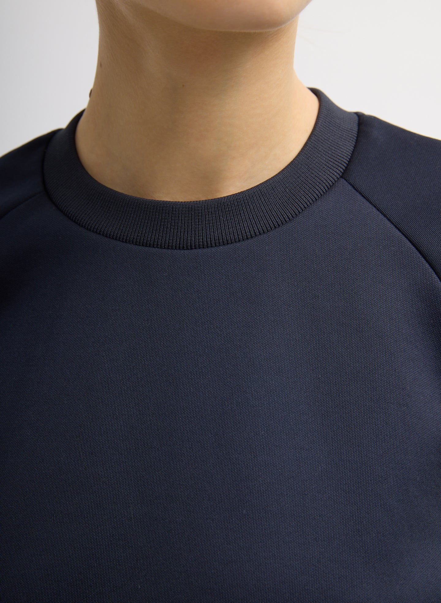 Navy Active Knit Raglan Top - closeup of neckline