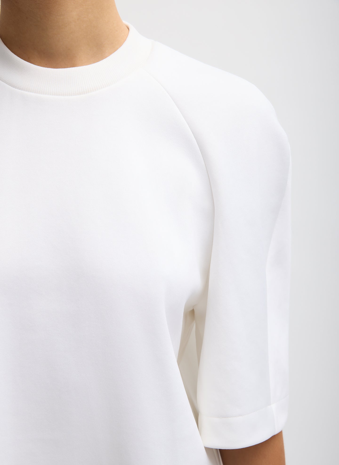 White Active Knit Raglan Top - closeup of neckline