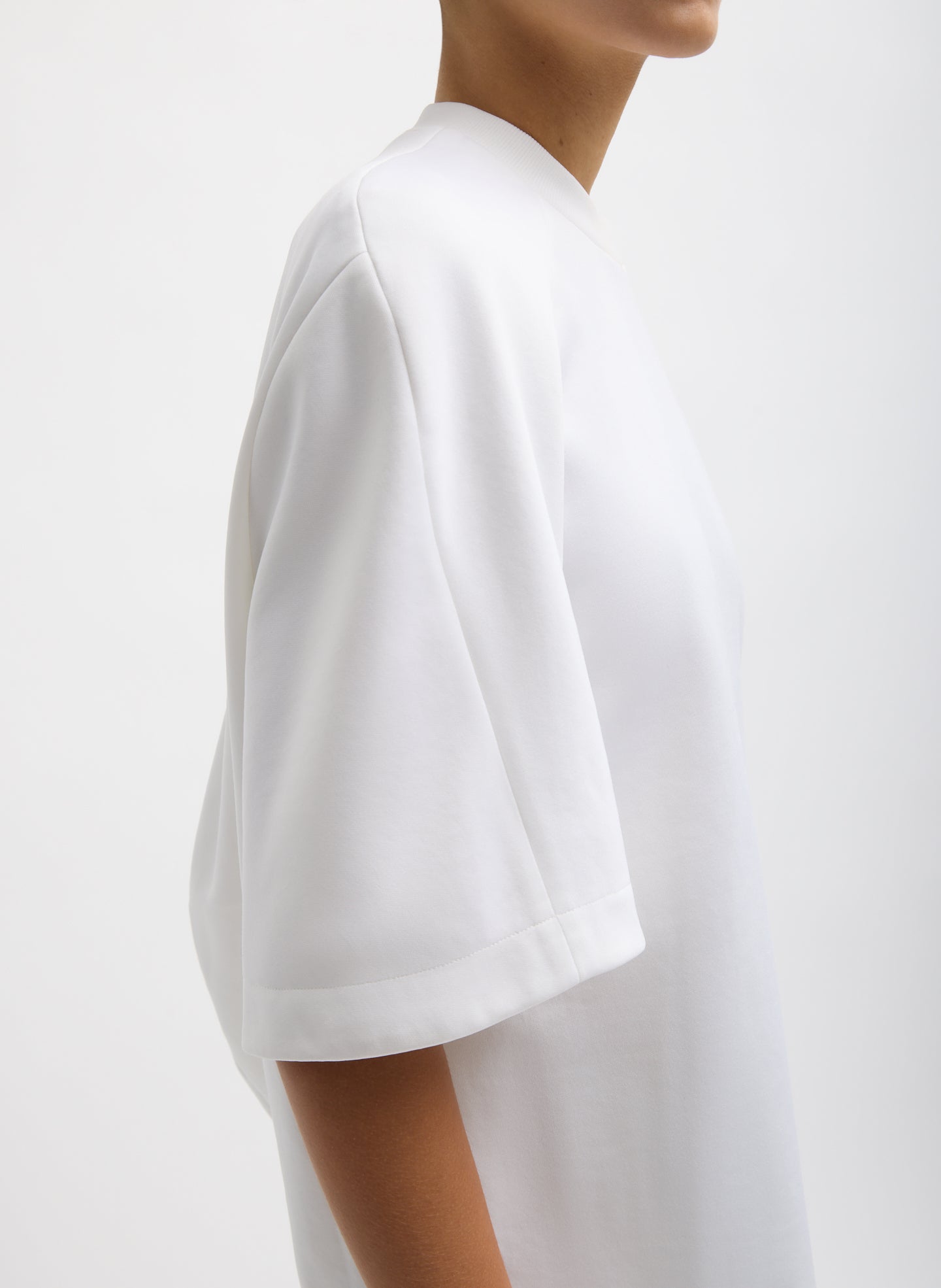 White Active Knit Raglan Top - closeup of raglan sleeve