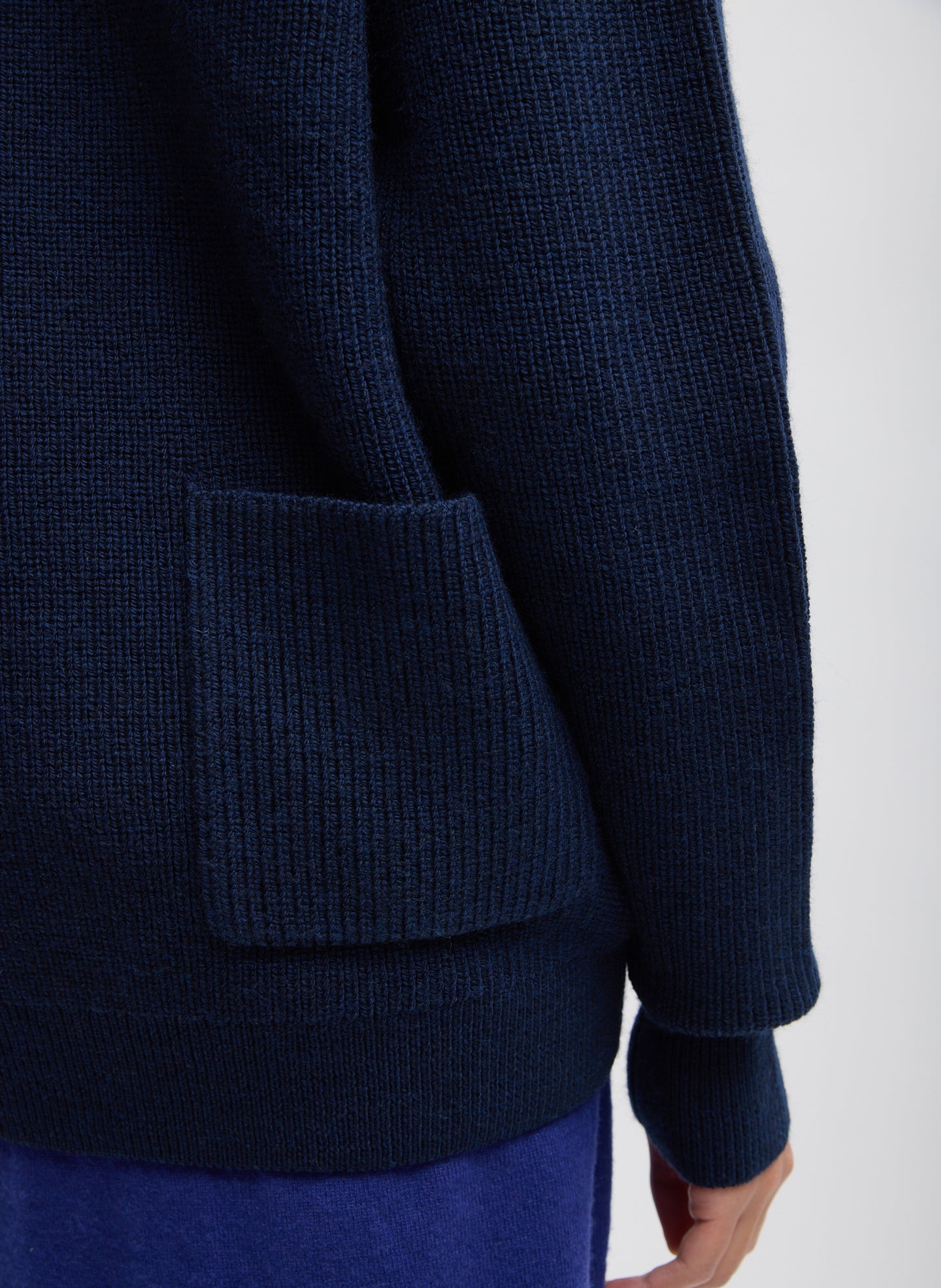 Dark Navy Cardigan Stitch V-Neck Easy Pullover - closeup of back pocket detail