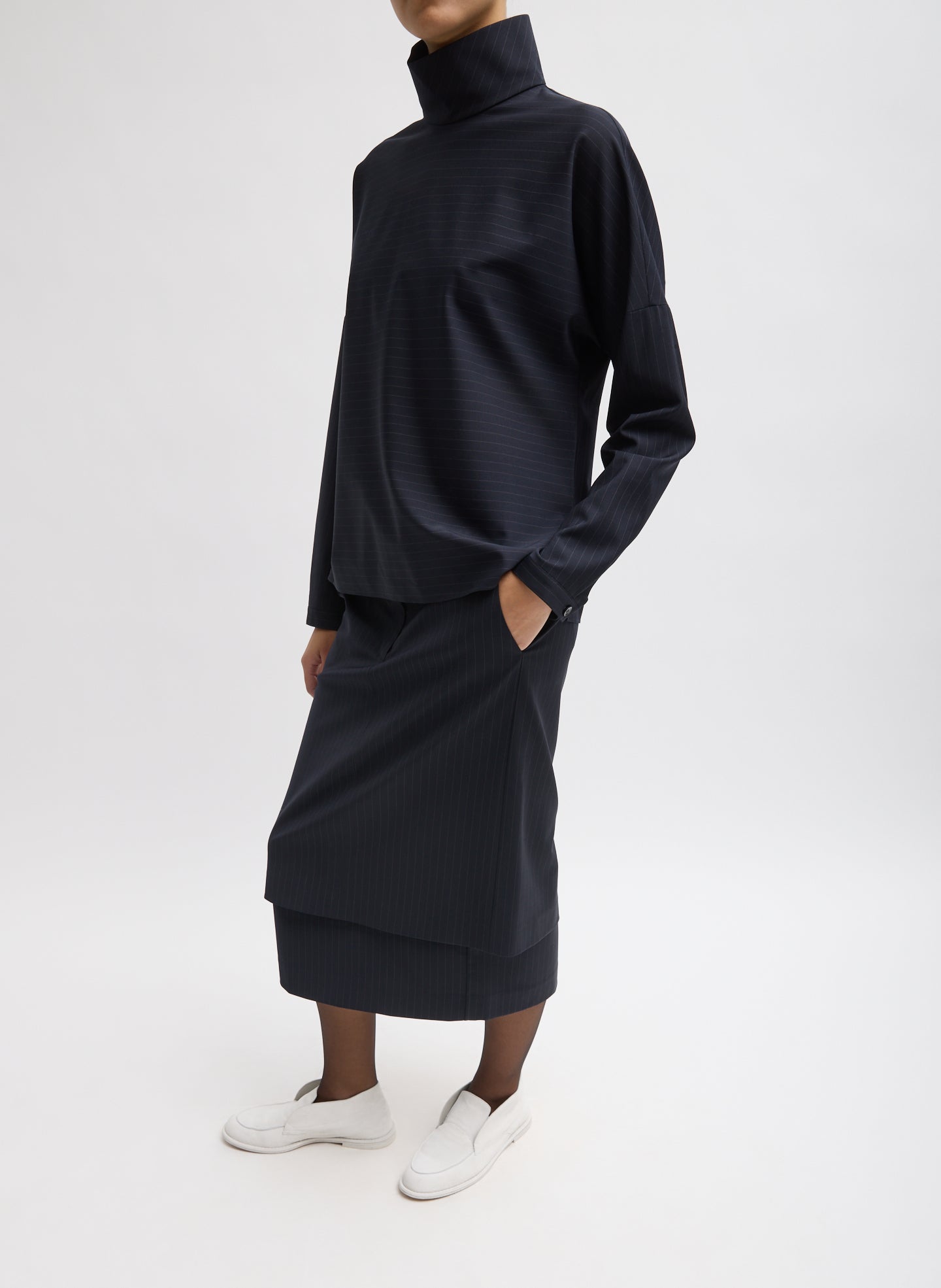 Navy Multi Mier Pinstripe Convertible Skirt - with matching detachable panel, side view on model