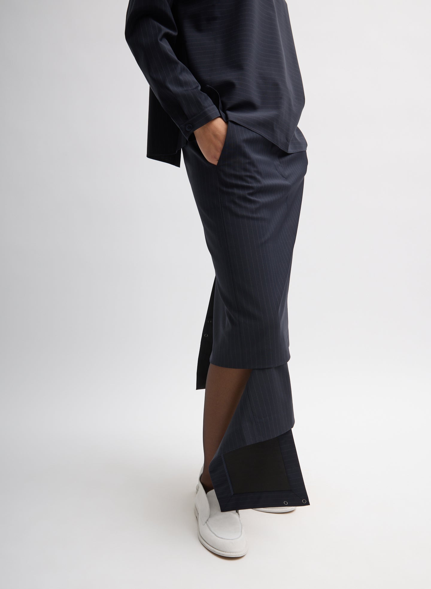 Navy Multi Mier Pinstripe Convertible Skirt - with matching detachable panel, side view on model