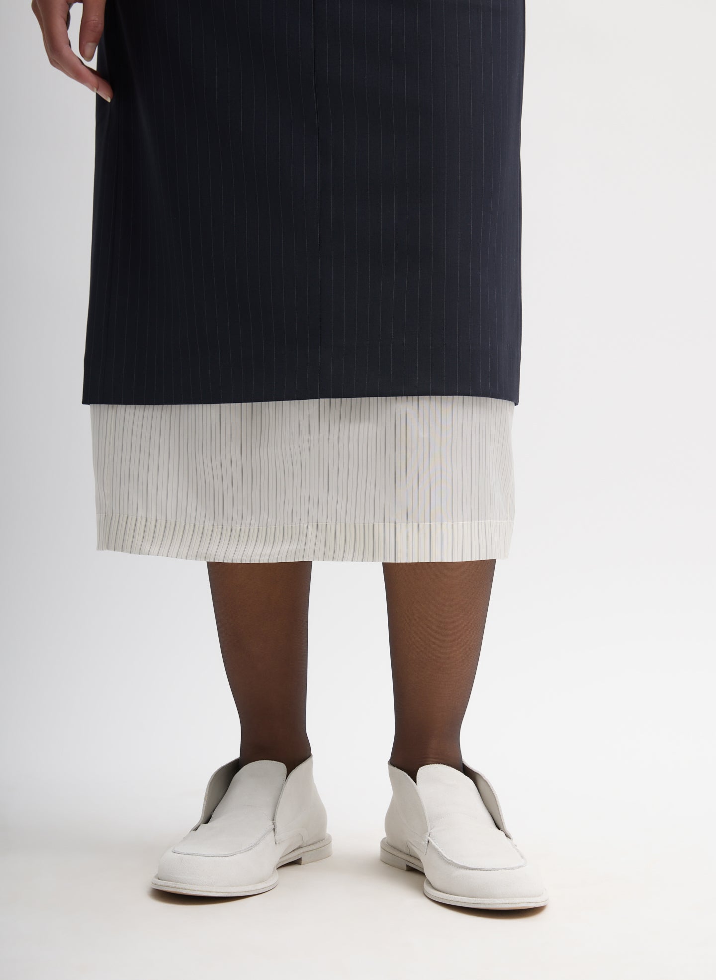 Navy Multi Mier Pinstripe Convertible Skirt - closeup of contrasting detachable panel at hem