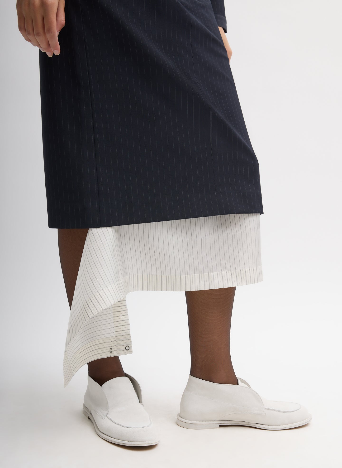 Navy Multi Mier Pinstripe Convertible Skirt - closeup of contrasting detachable panel at hem
