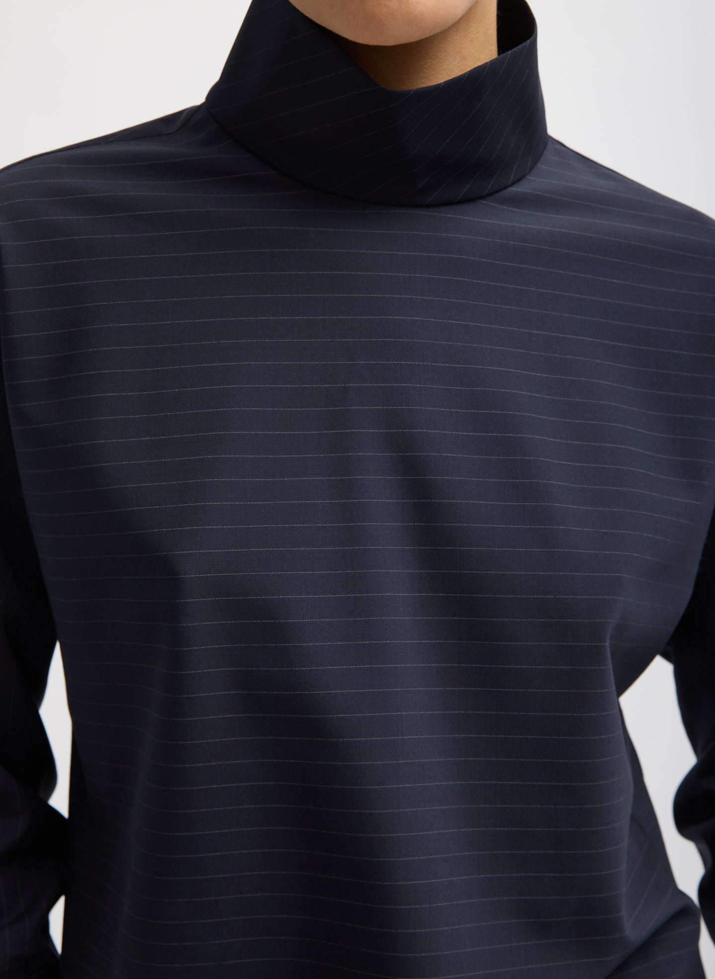 Navy Mier Pinstripe Funnel Neck Dolman Sleeve Top - closeup on stripe pattern and funnel neck