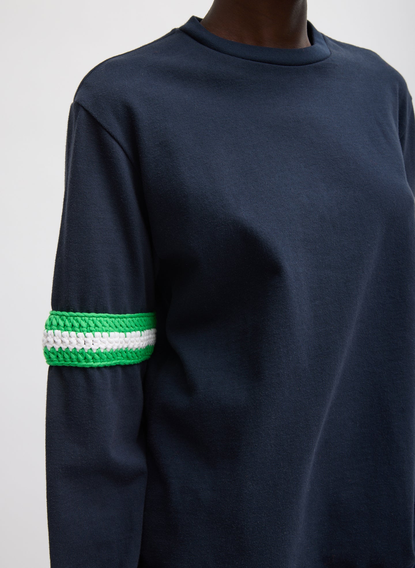 Navy Sport Knit Crewneck T-Shirt With Crochet Trim - closeup of crochet detail at sleeve