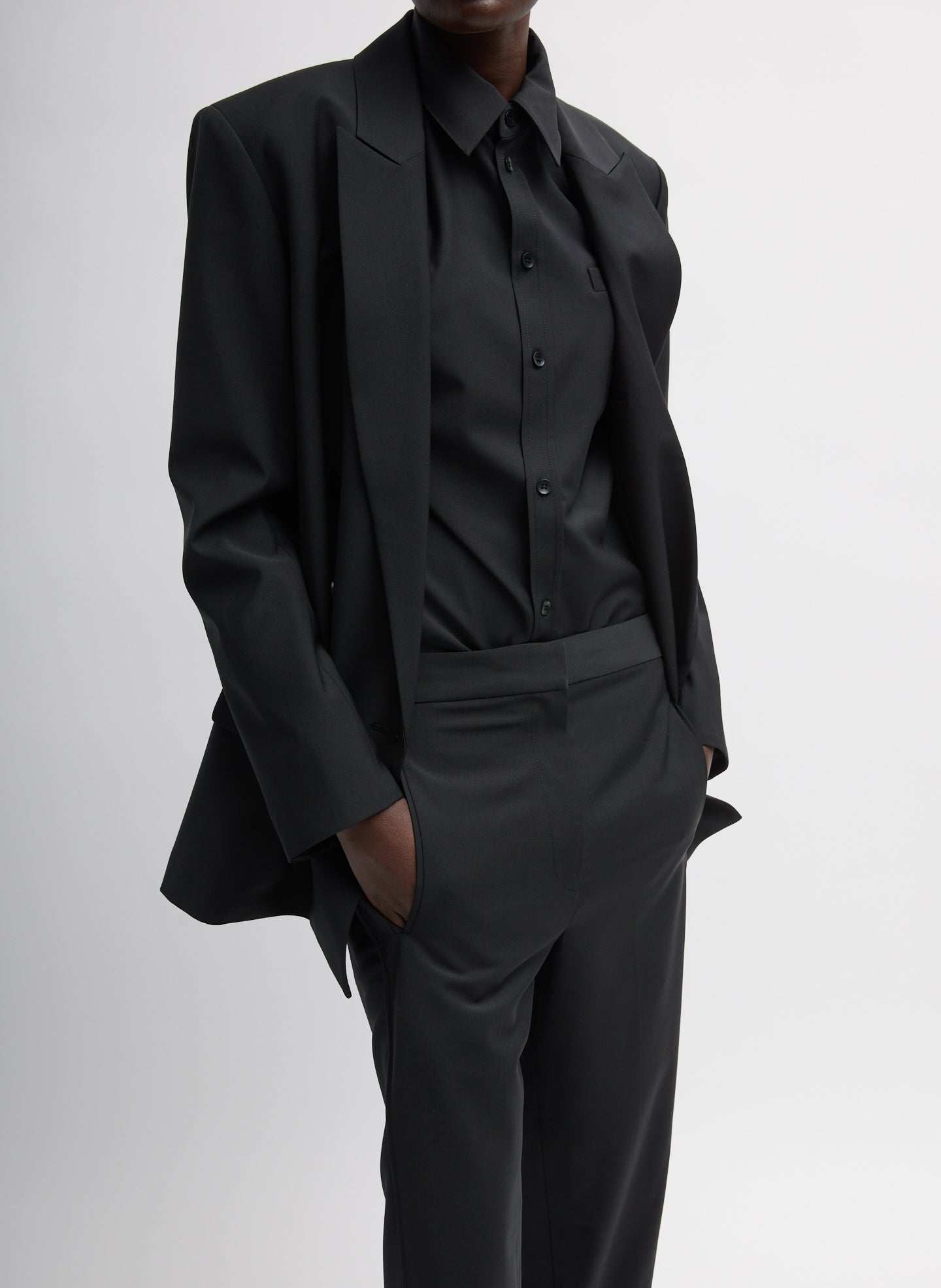 Black Recycled Tropical Wool Blazer With Back Belt - unbuttoned, front view on model