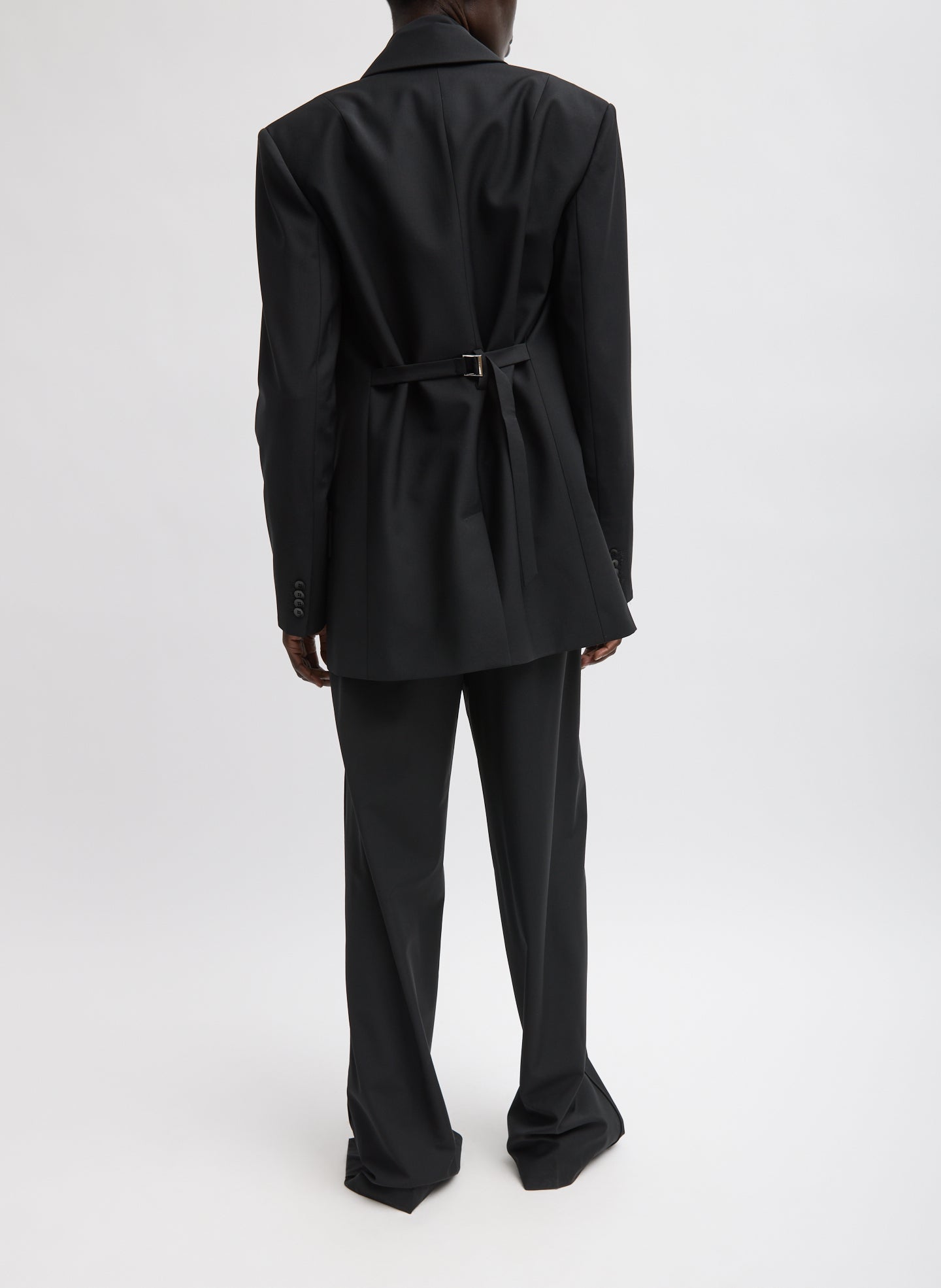 Black Recycled Tropical Wool Blazer With Back Belt - full look, back view on model