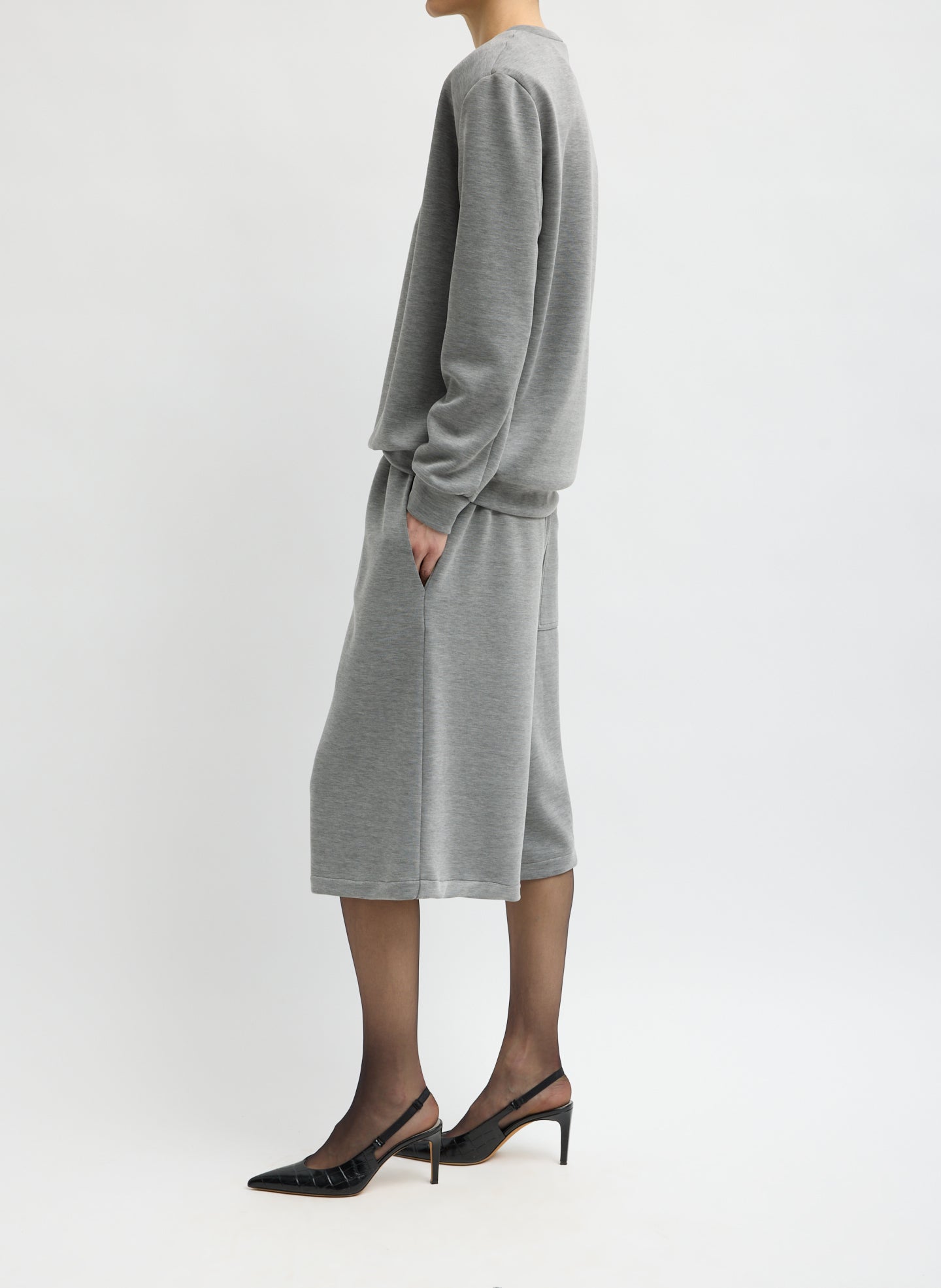 Heather Grey Feather Weight Viscose Neoprene Relaxed Short - long sweat short, side view on model
