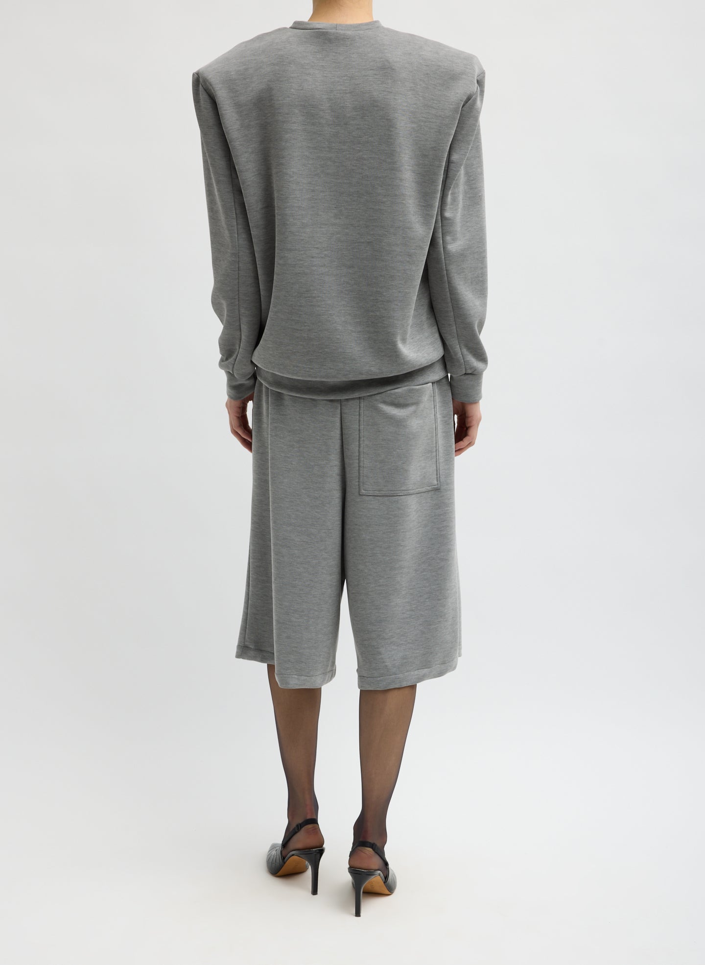 Heather Grey Feather Weight Viscose Neoprene Relaxed Short - long sweat short, back view on model