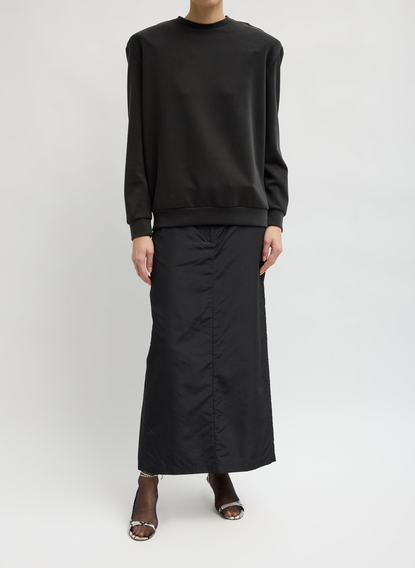 Black Feather Weight Viscose Removable Shoulder Pad Long Sleeve T-Shirt - front view on model