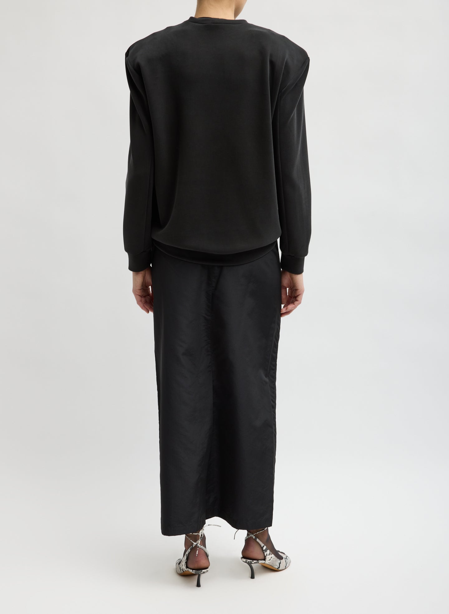 Black Feather Weight Viscose Removable Shoulder Pad Long Sleeve T-Shirt - back view on model