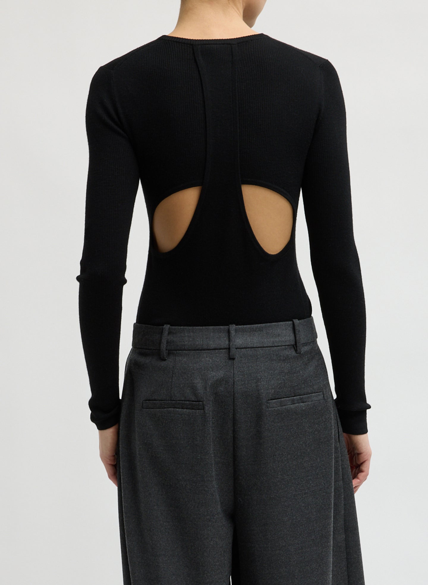 Black Feather Weight Long Sleeve Top - back view on model