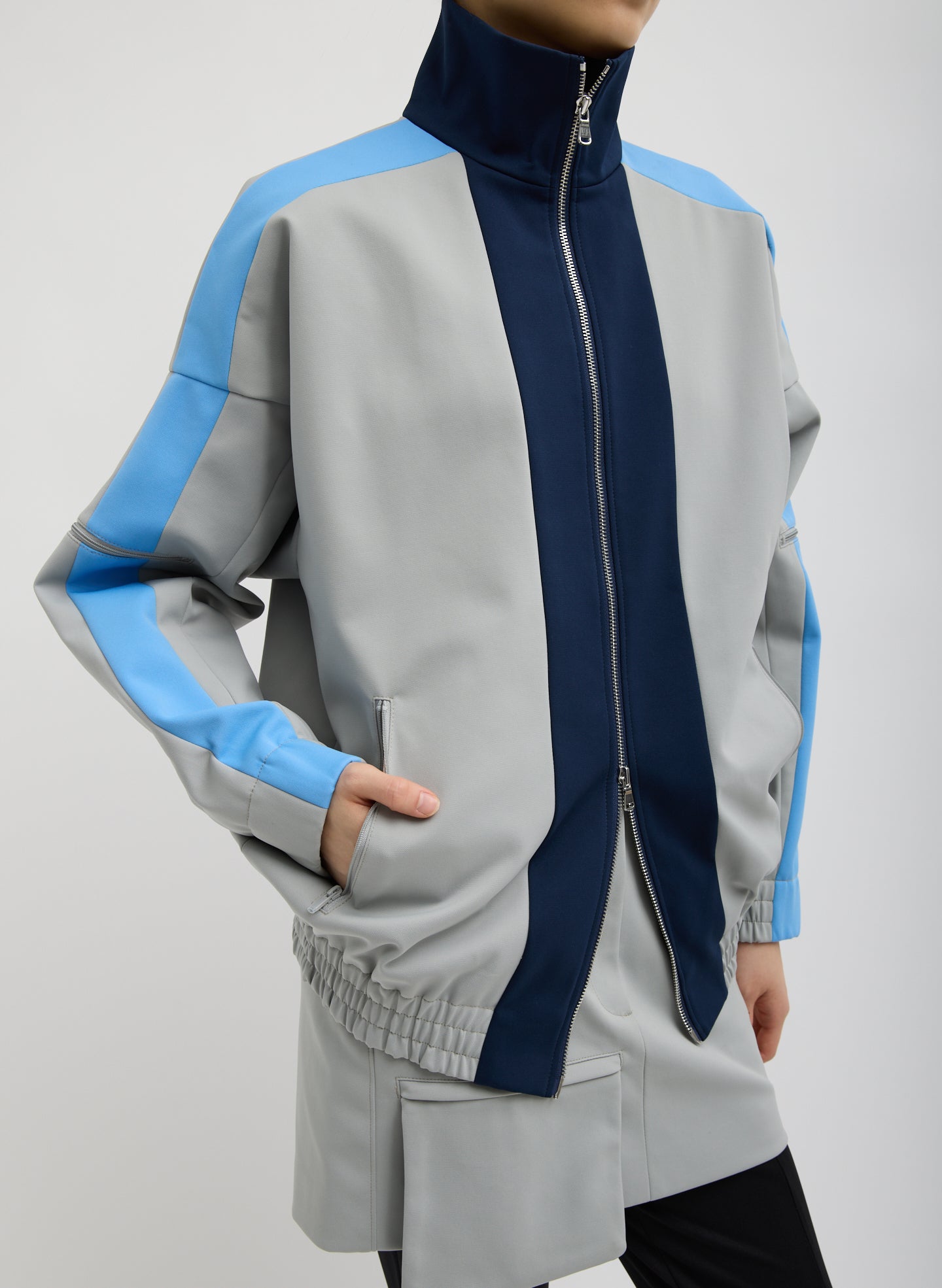 Grey Color Blocked Compact Tech Knit Bomber - front view on model