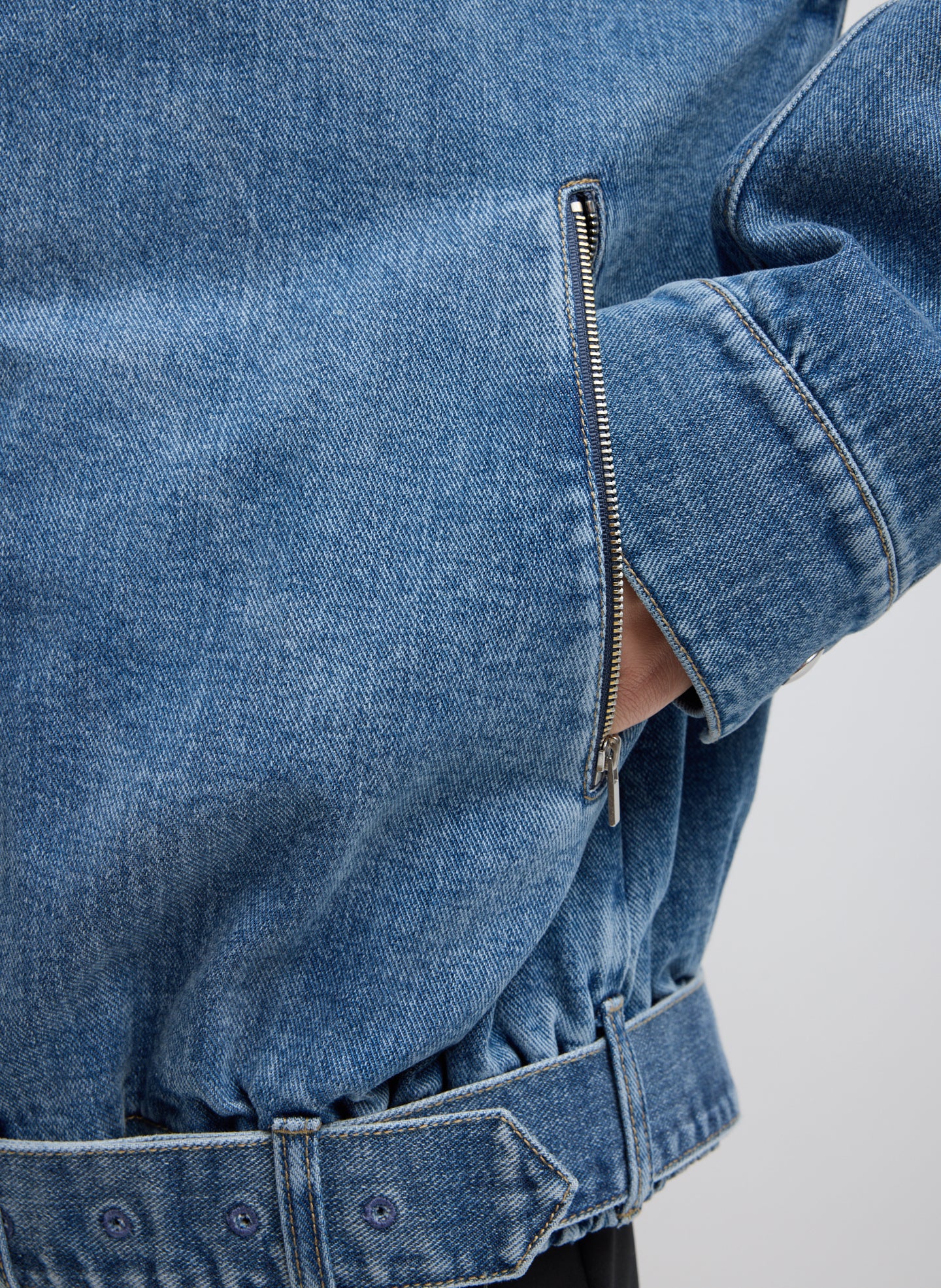 Classic Blue Denim Moto Bomber - closeup of side zip pocket
