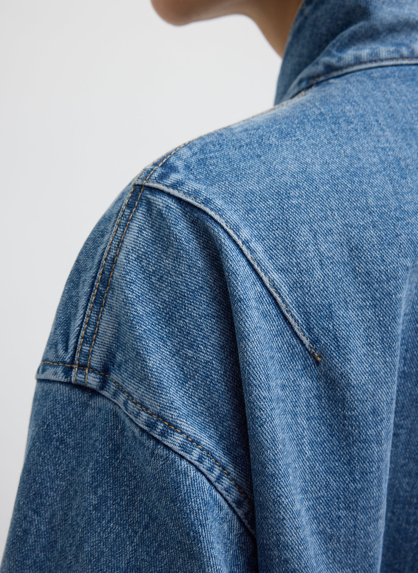 Classic Blue Denim Moto Bomber - closeup of seam detail at shoulder
