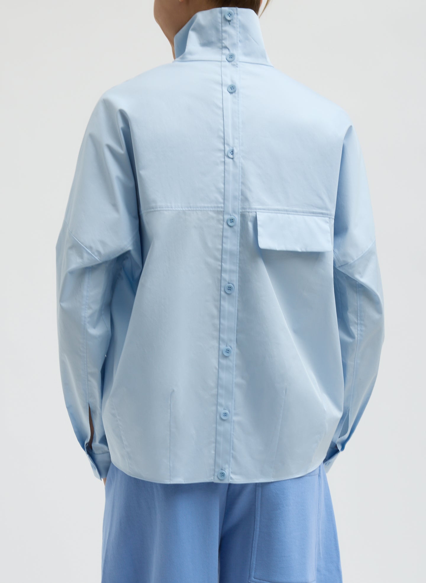 Chambray Blue Eco Poplin Funnel Neck Dolman Top - long sleeve top, back view on model