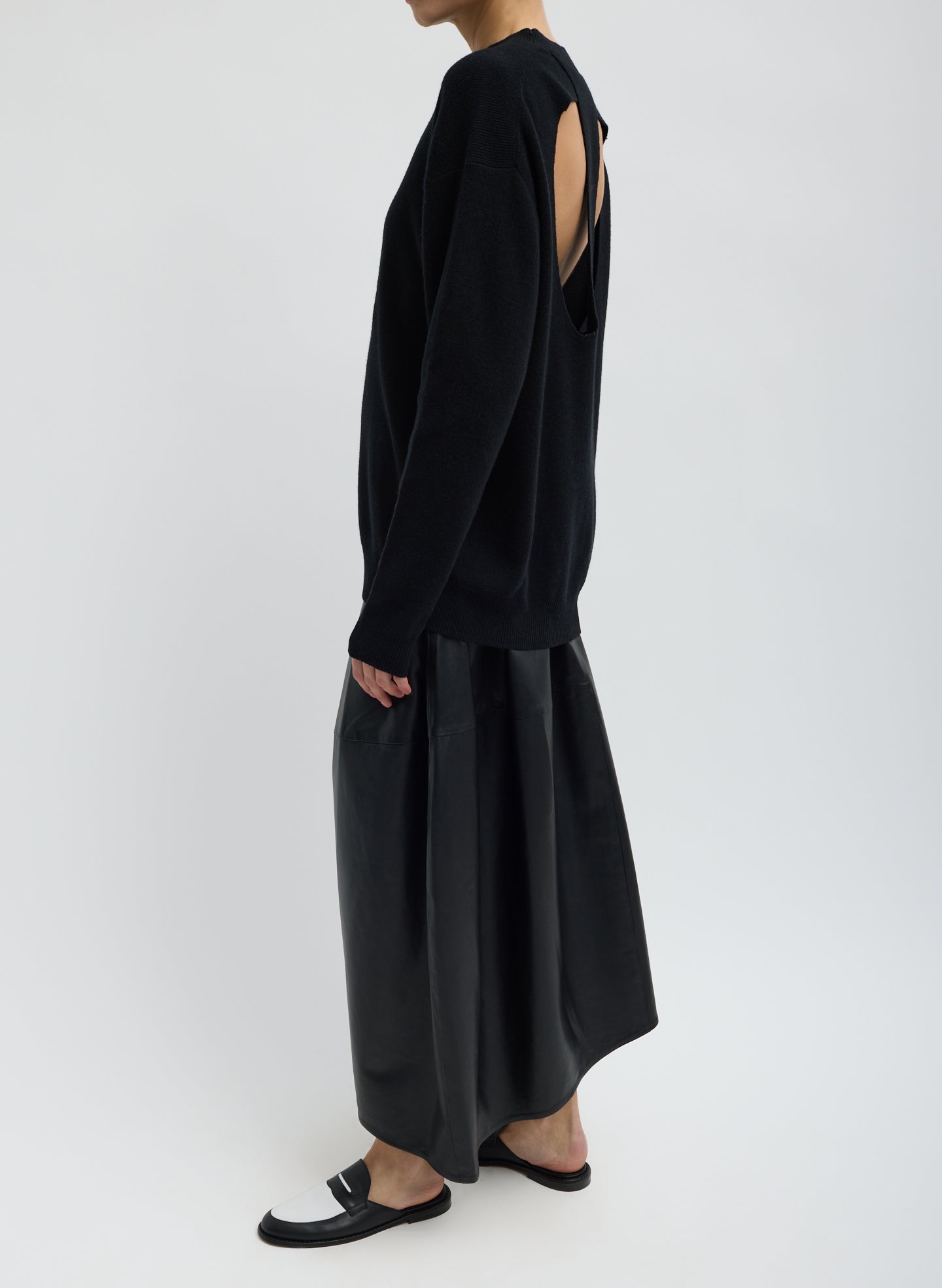 Black Leather Asymmetrical Balloon Skirt - leather midi skirt, side view on model