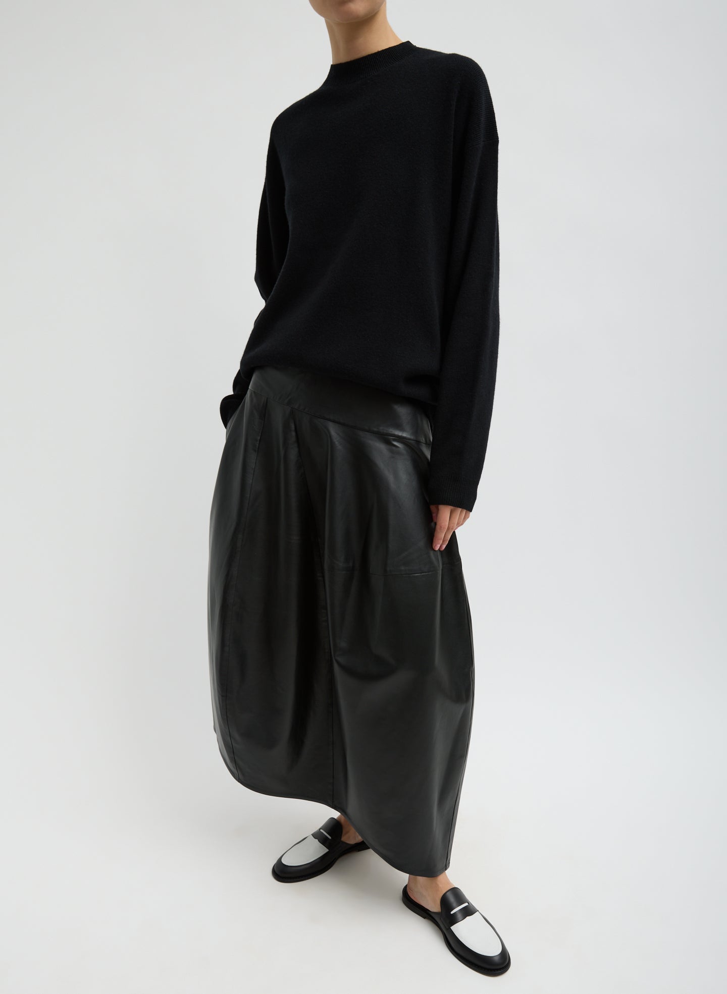 Black Leather Asymmetrical Balloon Skirt - leather midi skirt, front view on model