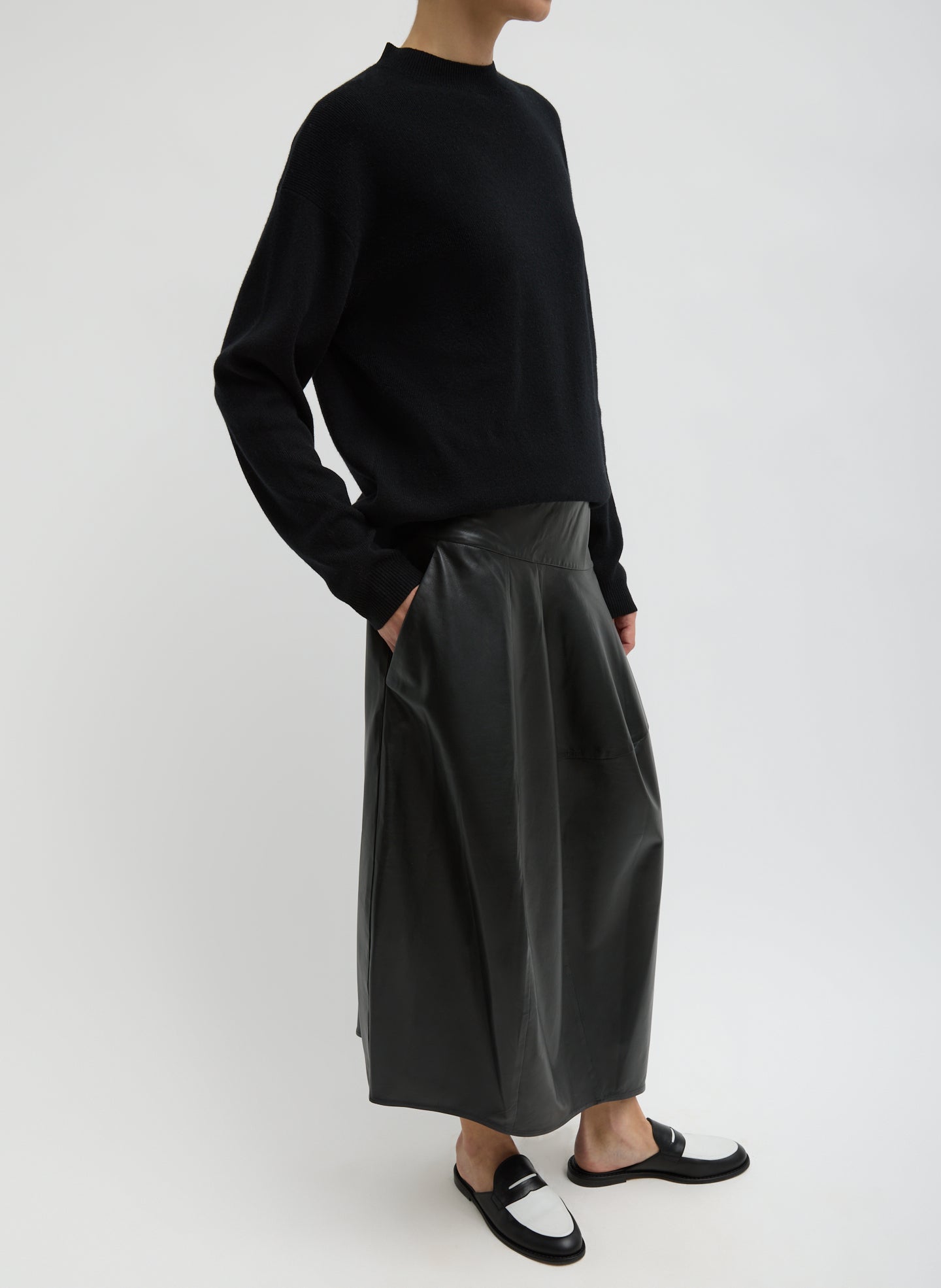 Black Leather Asymmetrical Balloon Skirt - leather midi skirt, side view on model