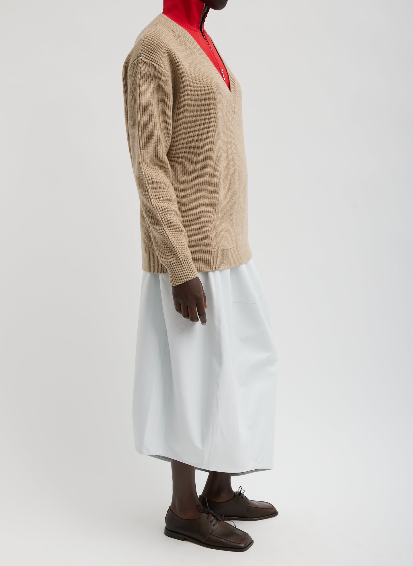 Optic White Leather Asymmetrical Balloon Skirt - leather midi skirt, side view on model