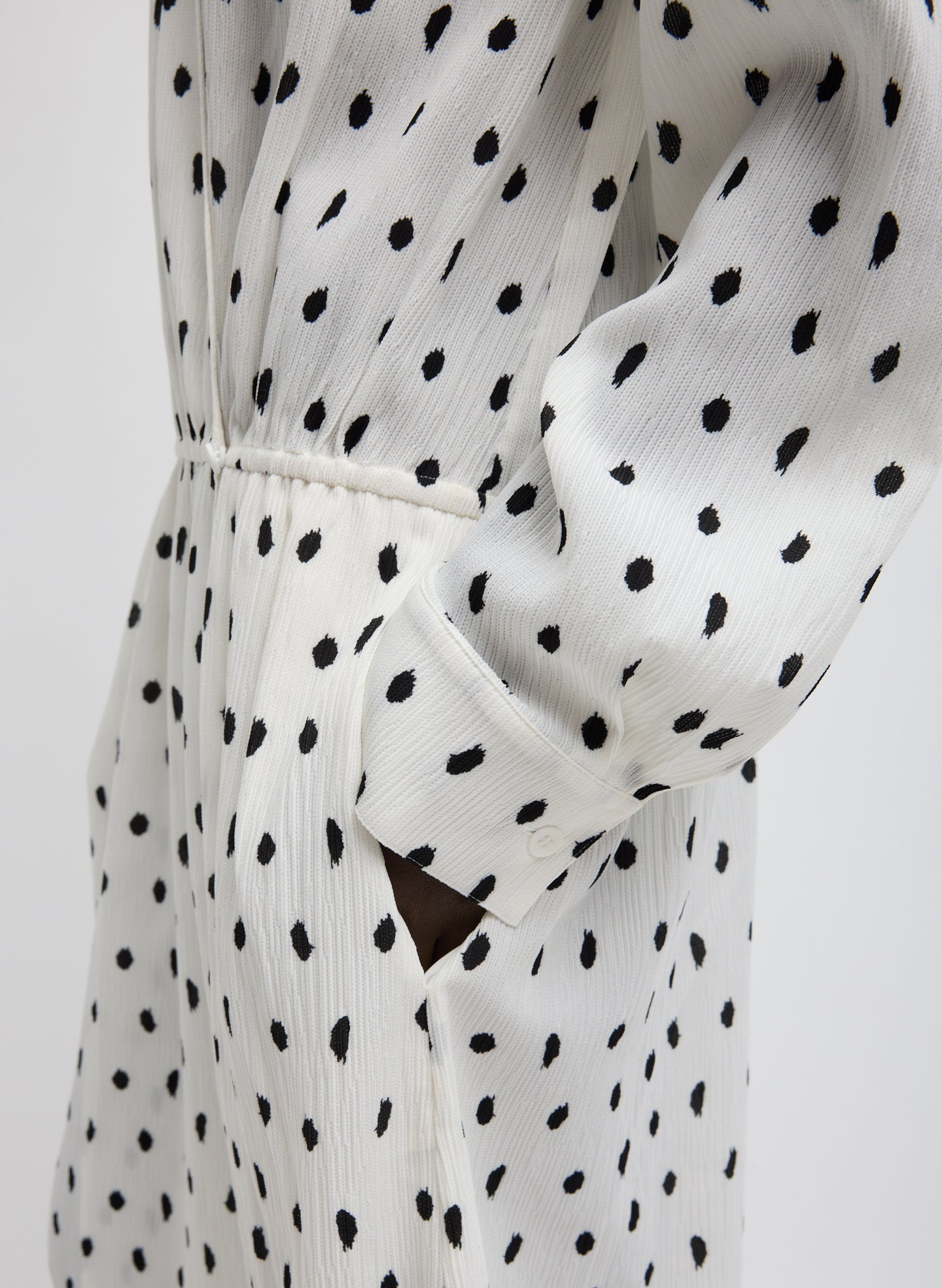 Black and White Scribble Dot Print Strech Plisse Wrap Dress - closeup of patterned plisse fabric