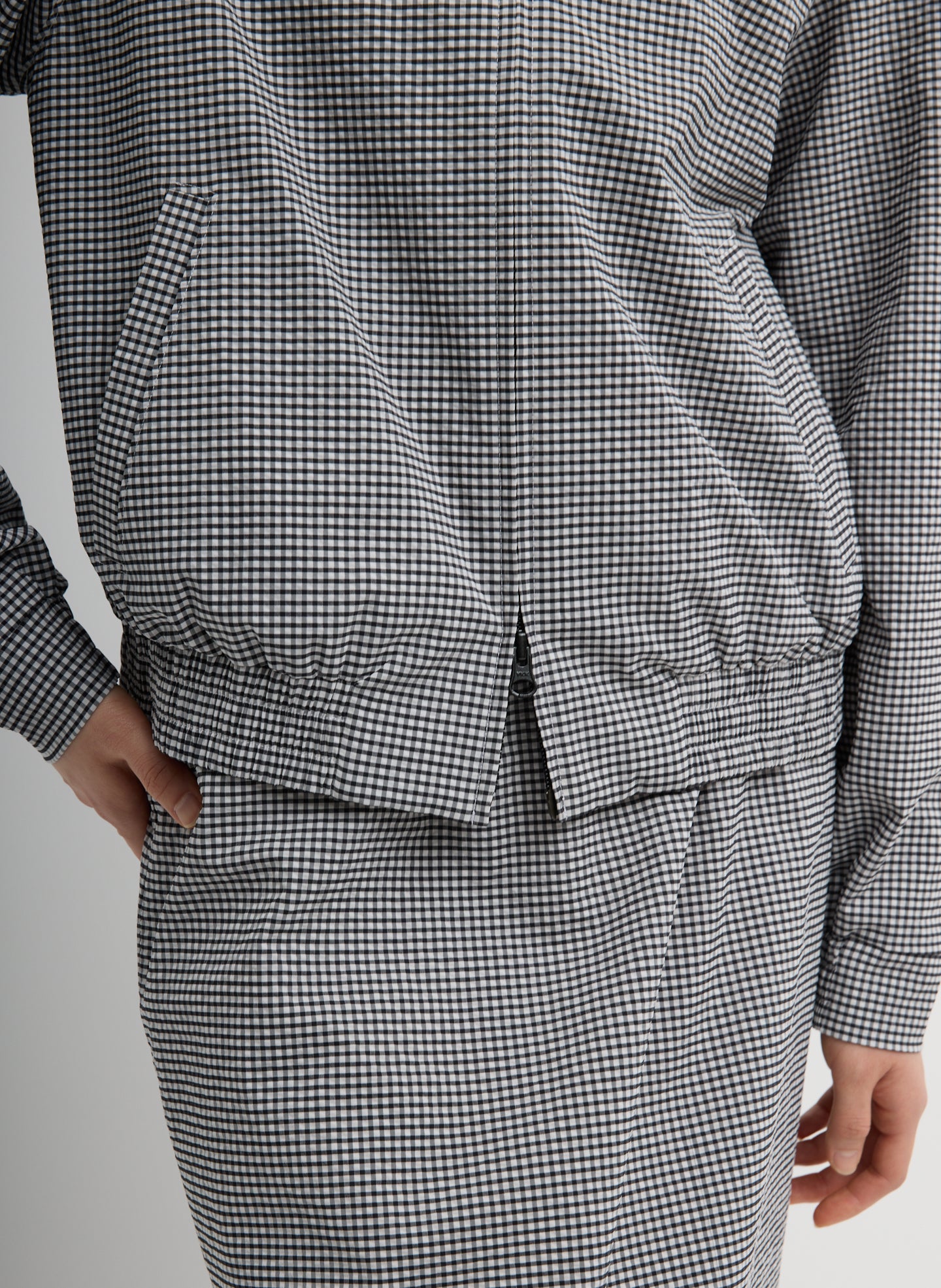 Black and White Tech Gingham Track Jacket - closeup of front zip up detail