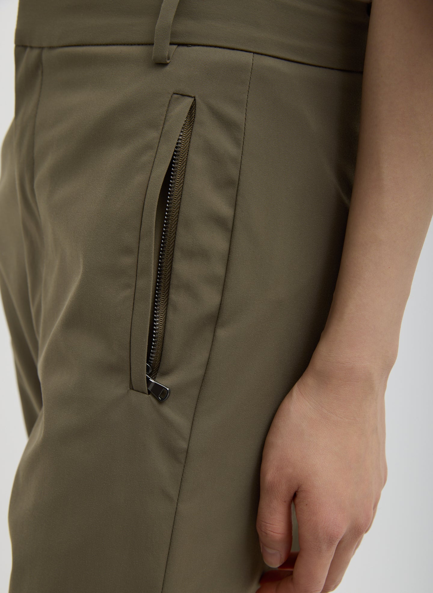Dark Hazelnut Green Tech Suiting Mark Trouser - closeup of zip pocket details