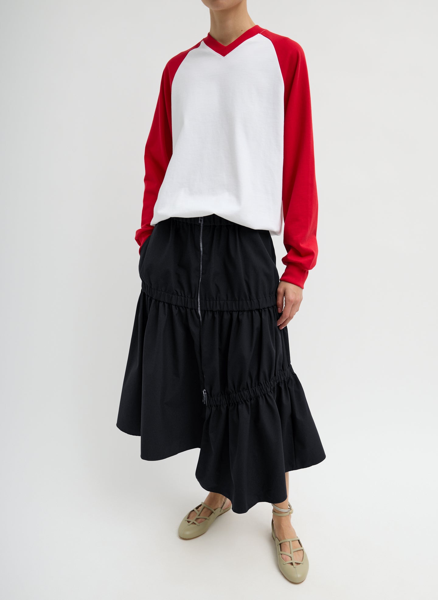 Black Tech Suiting Asymmetrical Skirt - zip up, front view on model