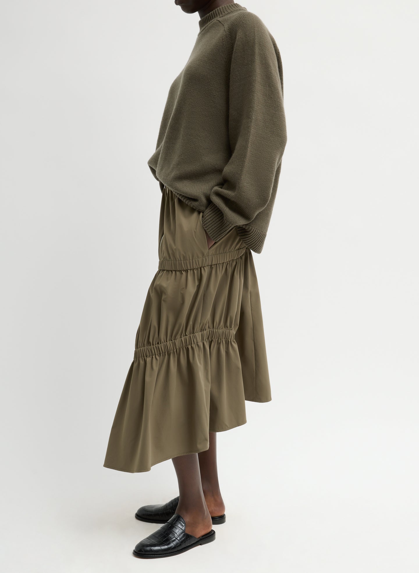 Dark Hazelnut Green Tech Suiting Asymmetrical Skirt - zip up, side view on model