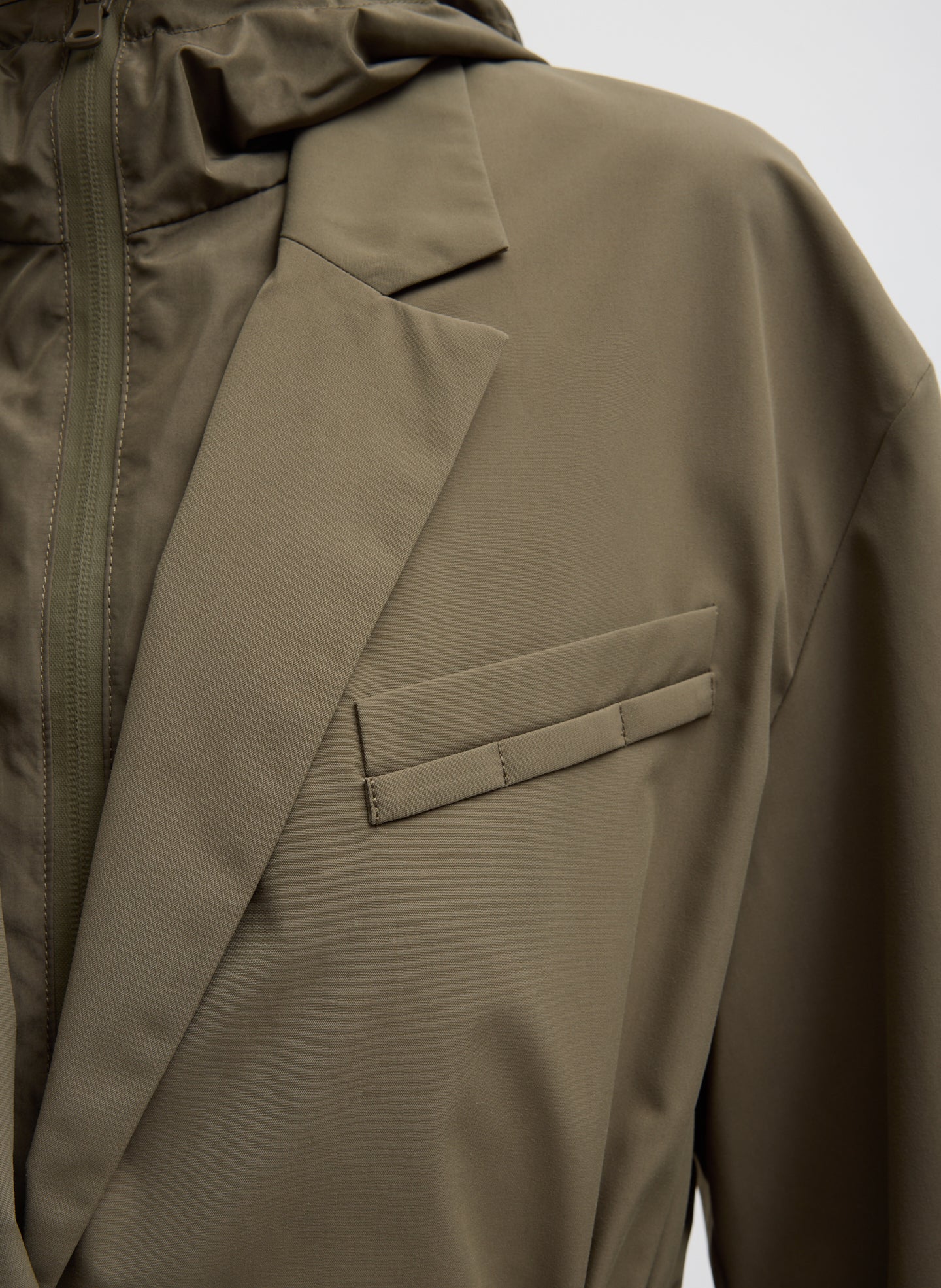 Dark Hazelnut Green Tech Suiting Anorak Blazer With Zip Off Vest - closeup of front pocket detail